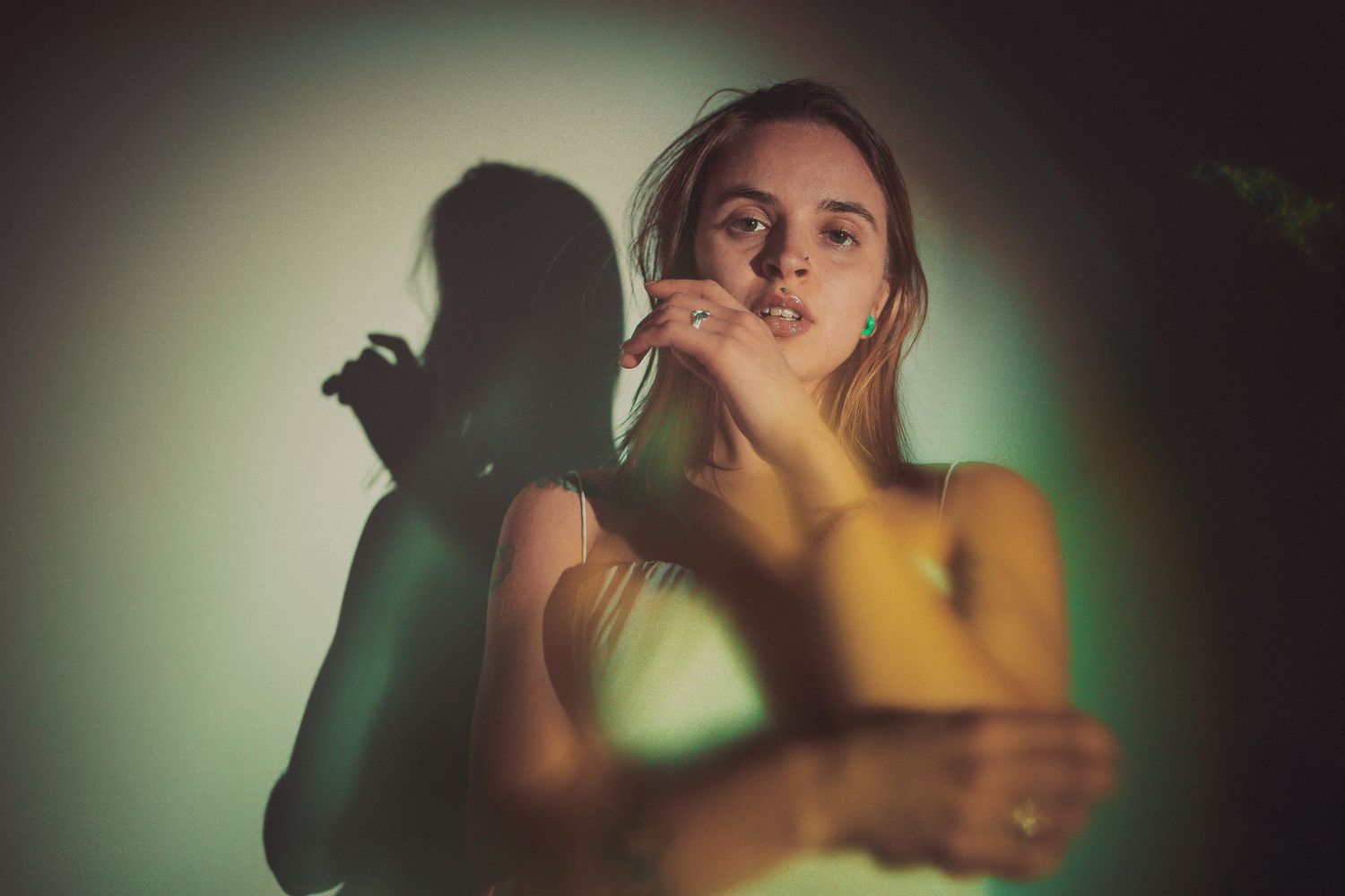 Artistic portrait series with vintage color toning and dramatic shadows.