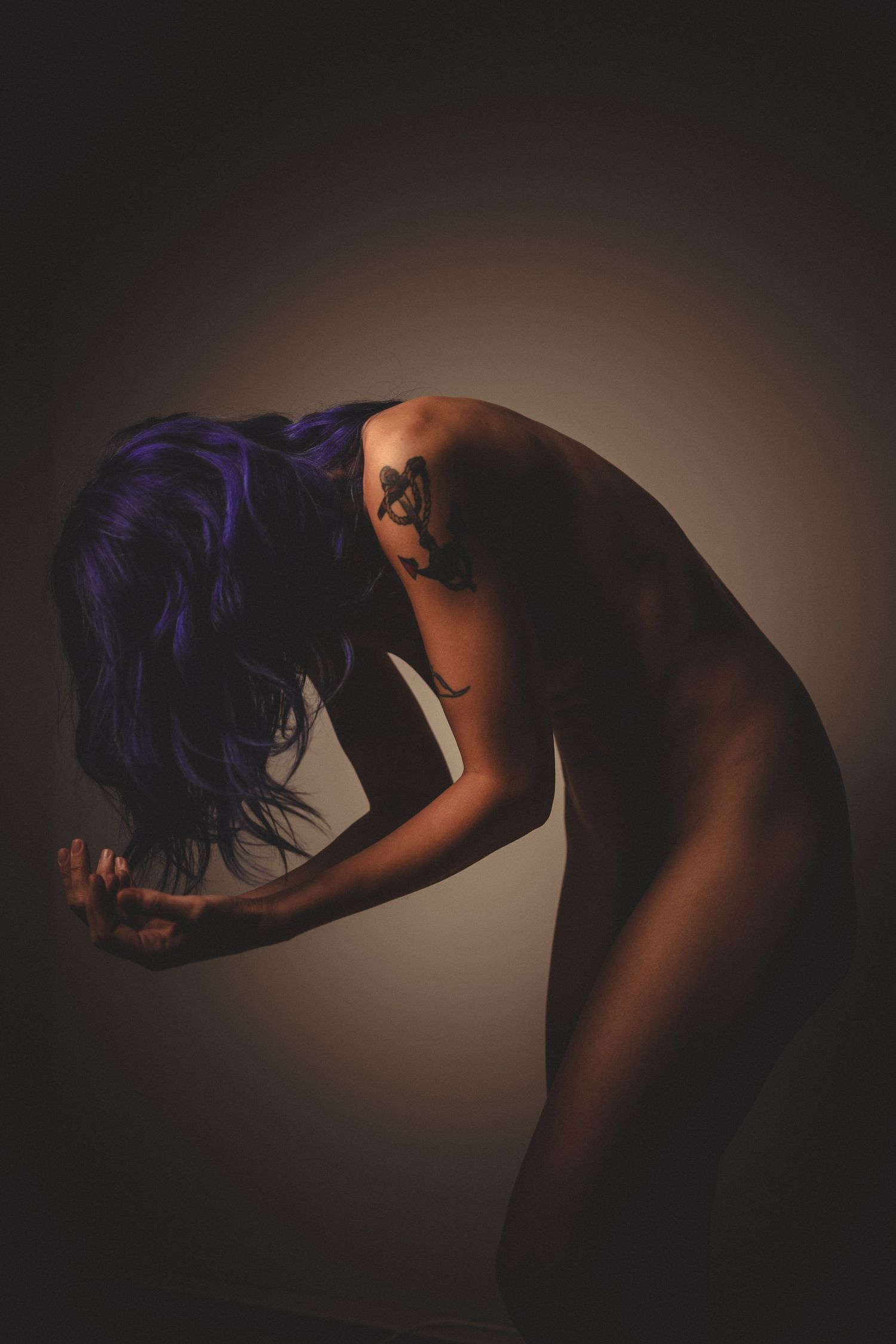 Minimalist black and white artistic nude study with curved forms.