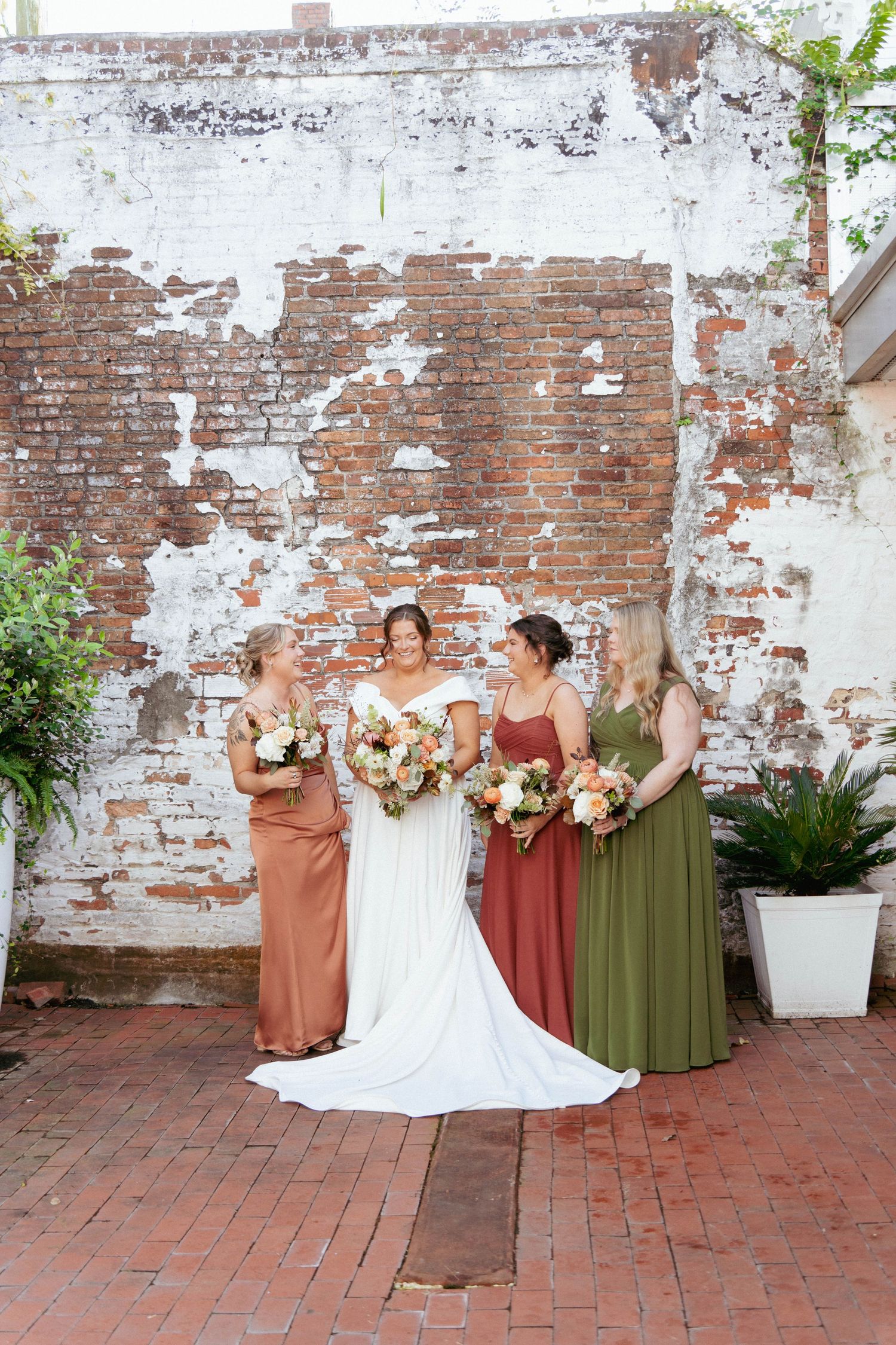 Bride with bridesmaids at The Atrium by Ligon Flynn, Wilmington, NC