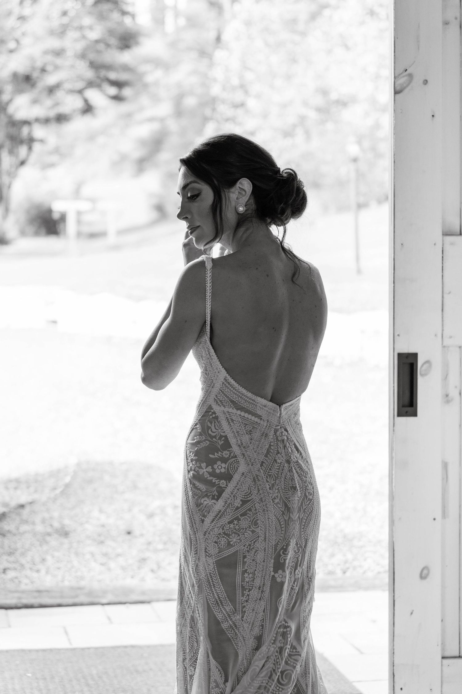 Silhouette of a bride getting ready for the wedding at The Barn on New River