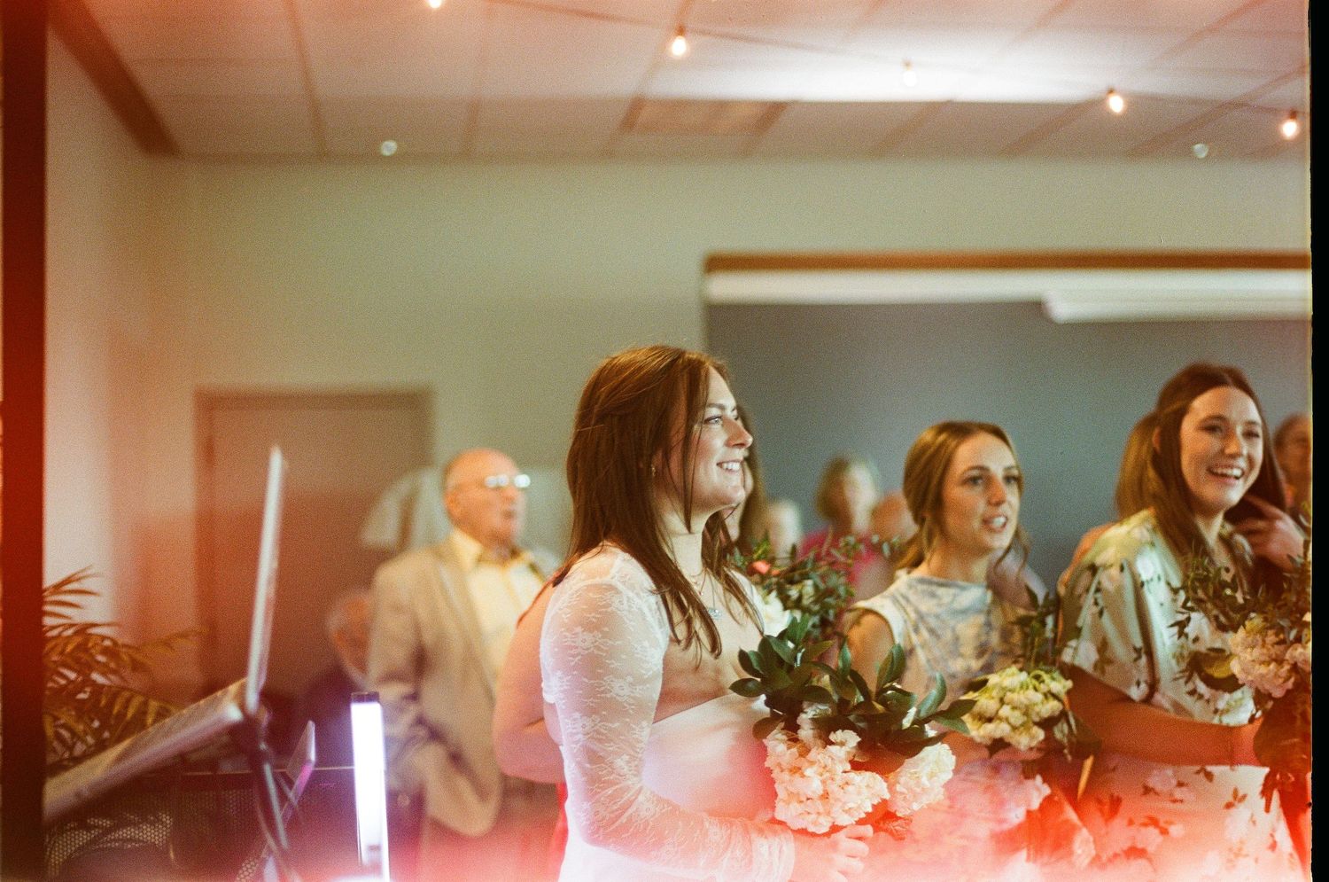 Wedding reception venue interior with soft lighting and decorative elements.