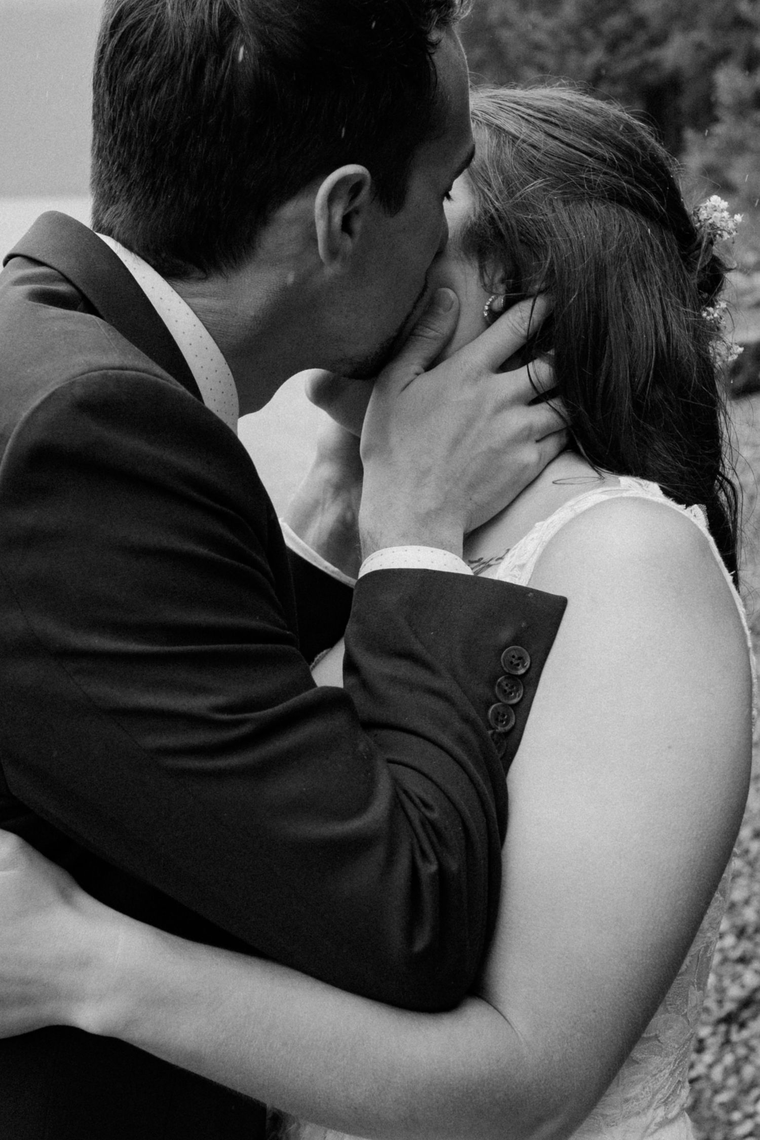 Black and white close-up sequence of couple's intimate wedding moment.