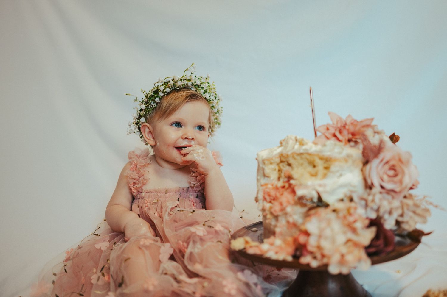 A vintage-style collage of pink and peach roses with cherub statues and decorative elements arranged in a dreamy composition.