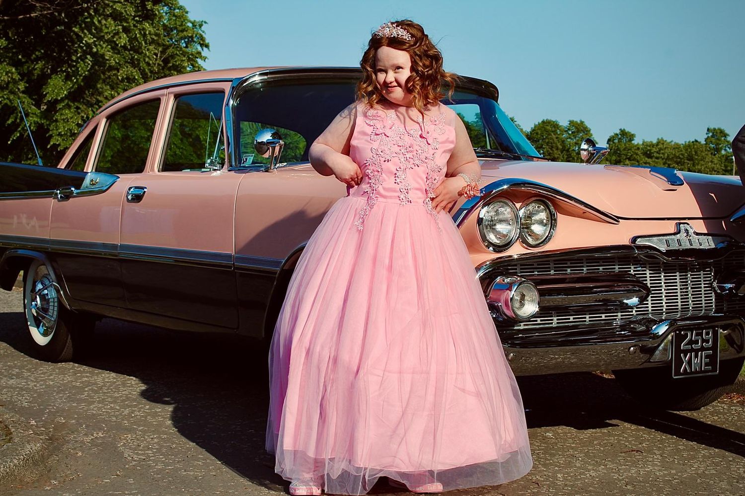 Posing for prom photographs in front of 60's style car, taken in Zetland Park, Grangemouth.