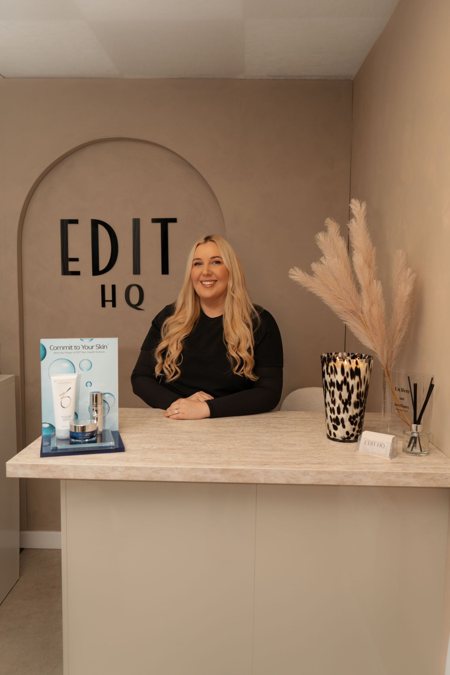 Edit HQ Kirkcaldy branding photography session of the owner posing in the salon reception area