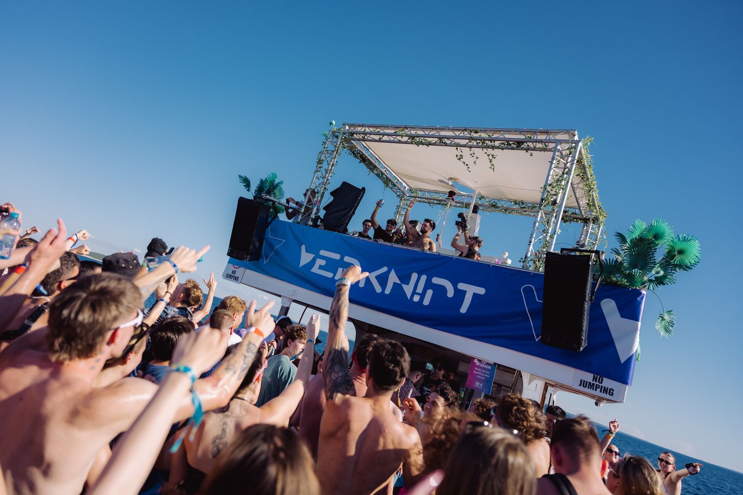 stage lights crowd energy Bradamedia DJ performance hard techno