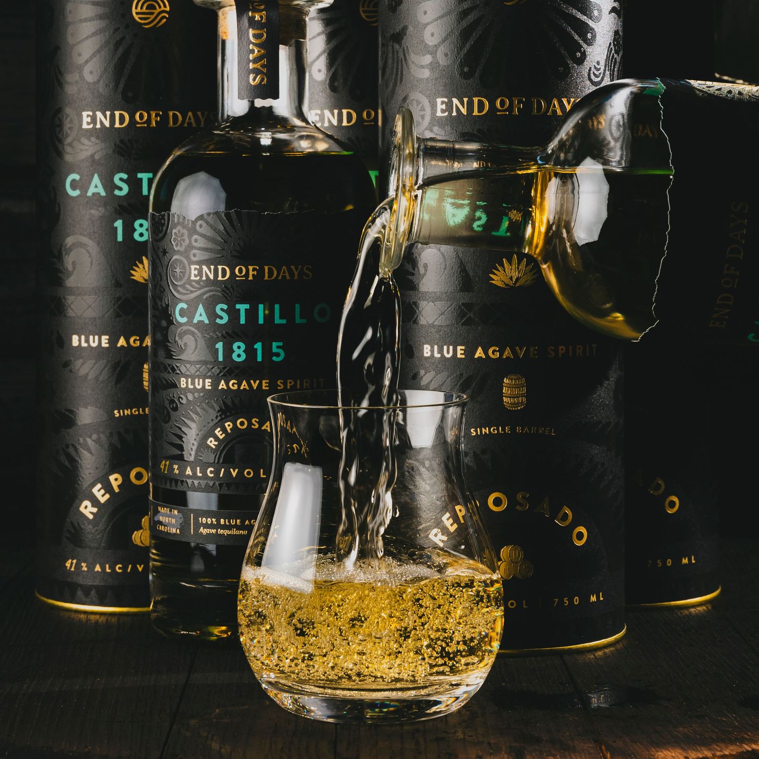 Dark whiskey bottles with golden liquid being poured into crystal glass.
