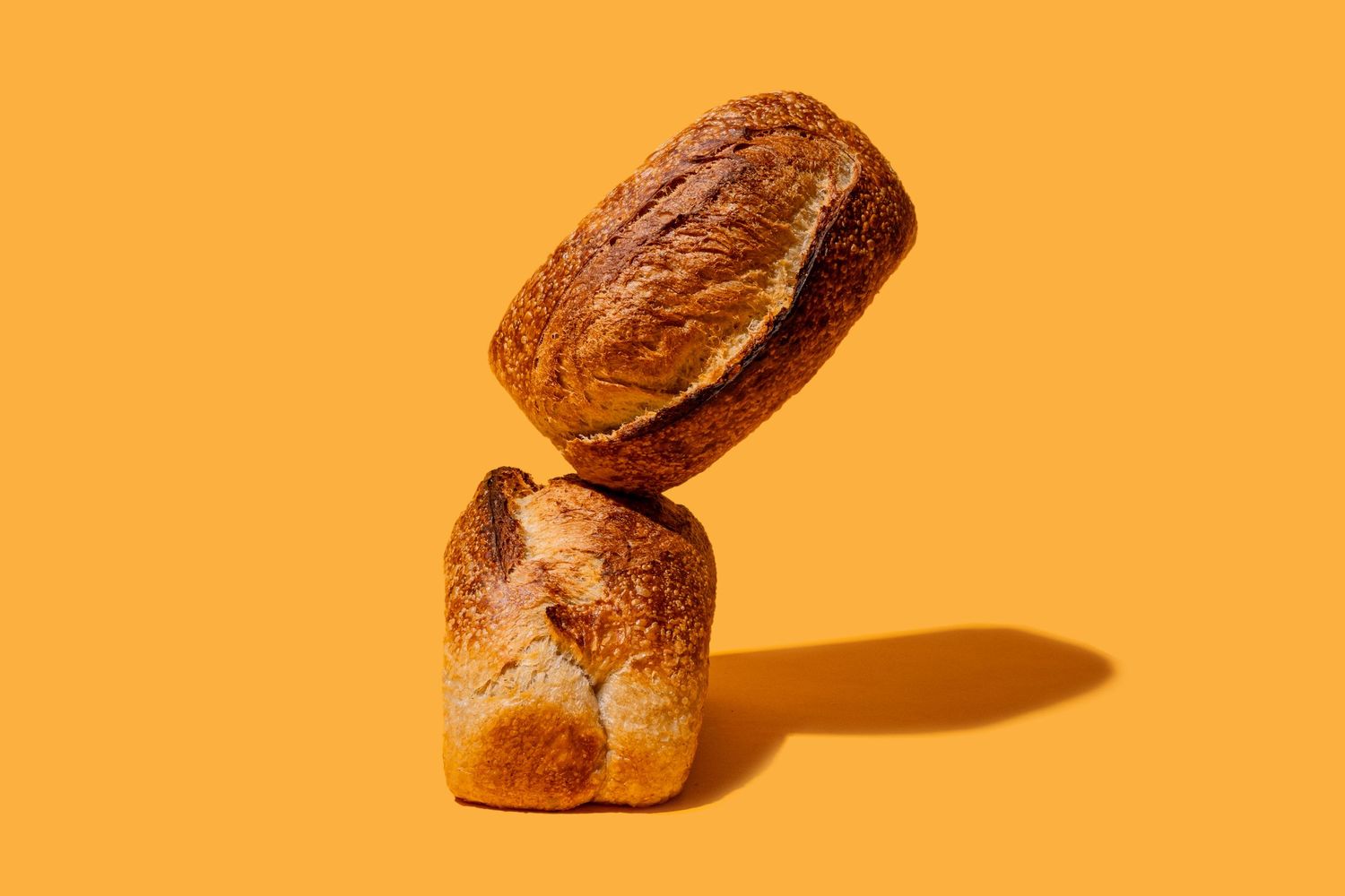 Sliced bread sections arranged against orange background.