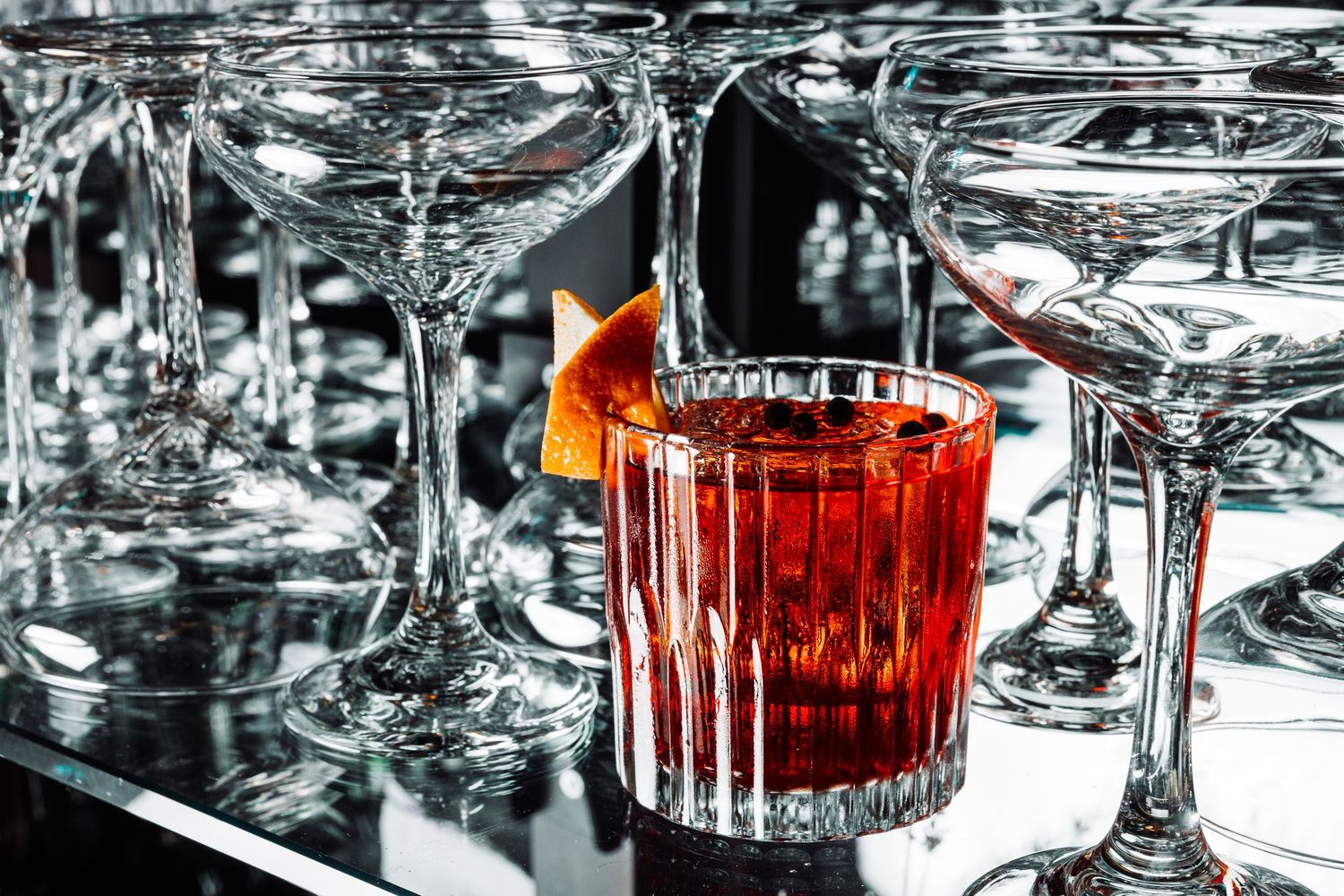 Close-up of crystal glassware with faceted patterns reflecting light and shadows.