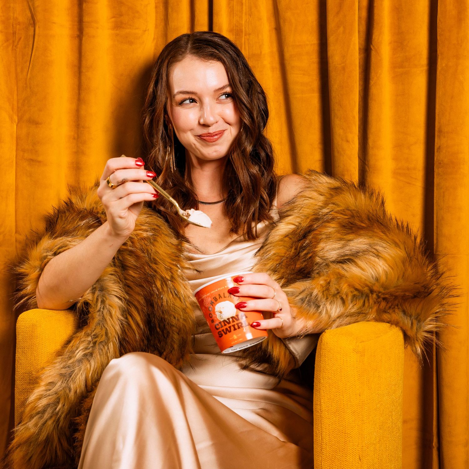 Cozy winter scene with warm lighting and beverage against golden backdrop.
