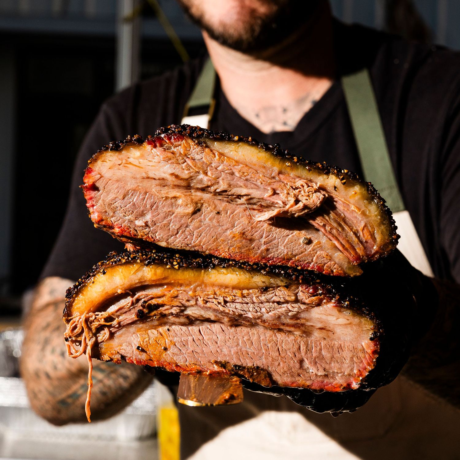 Close-up of sliced smoked brisket showing juicy meat texture.