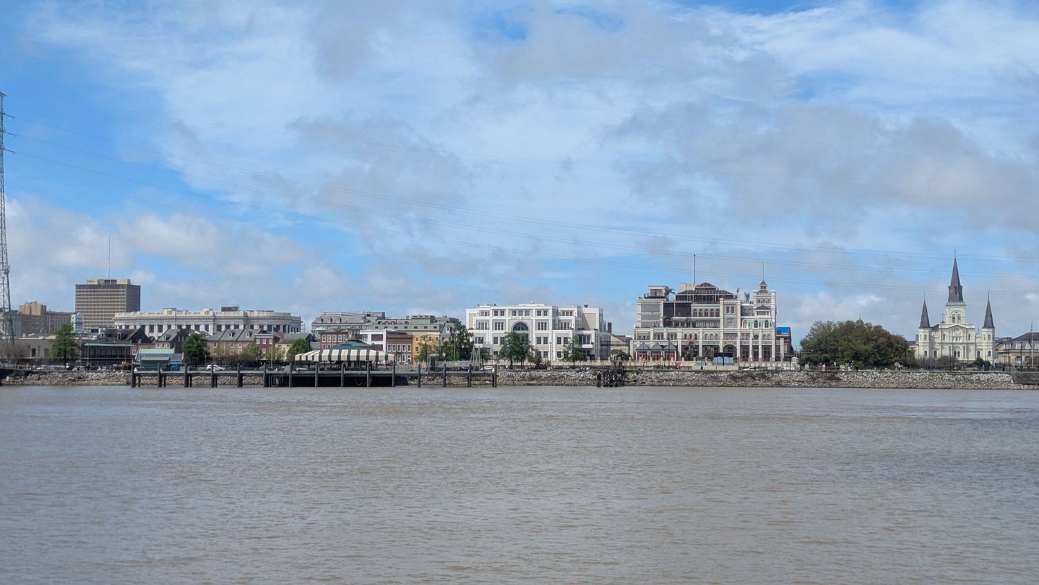Cityscape of New Orleans building skyline from a boat on the Mississippi