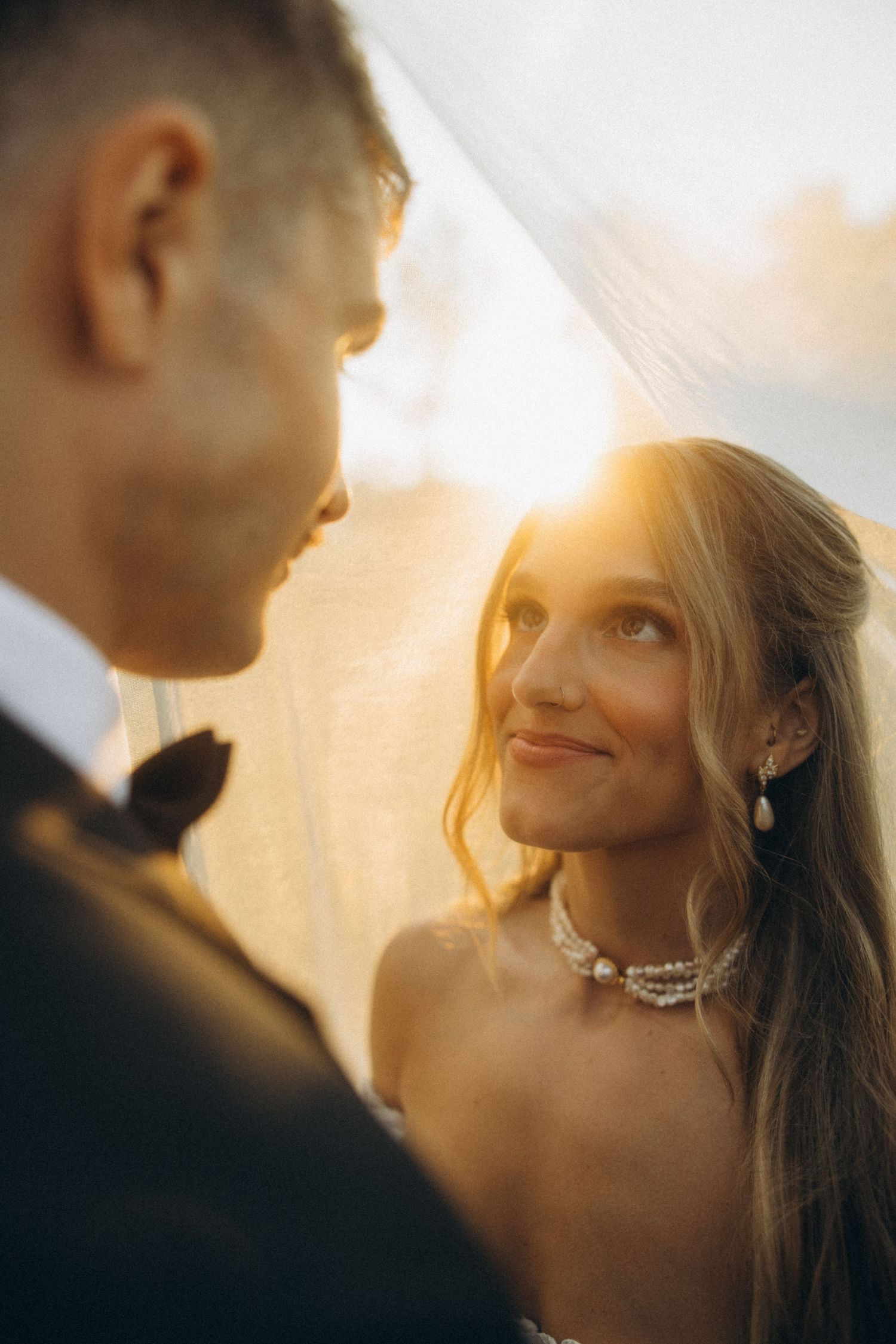 Romantic sunset portrait with soft golden lighting.