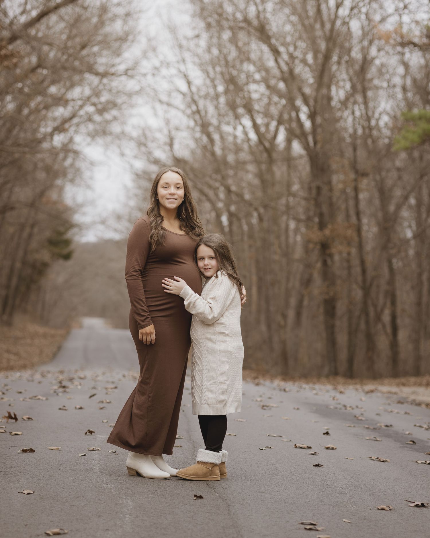 A series of candid shots showing a tender moment between two people on a leaf-covered path.