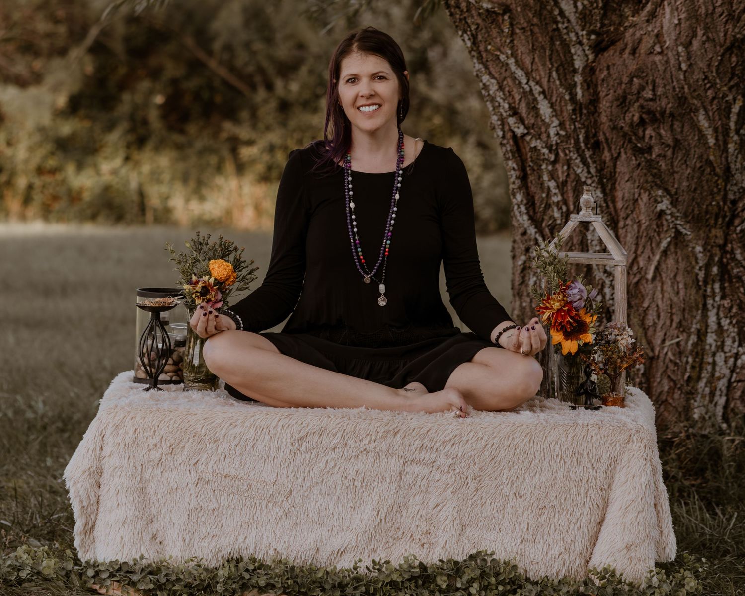A collection of outdoor portraits featuring someone sitting by a tree with decorative elements.