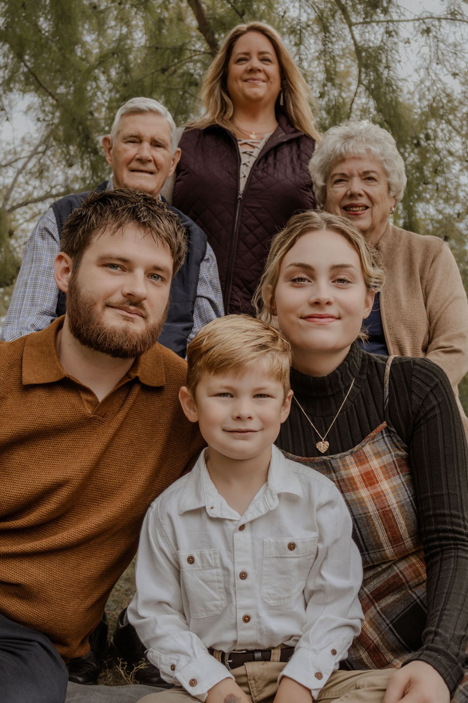 A warm-toned family photo series showing close-up candid moments during an outdoor portrait session.