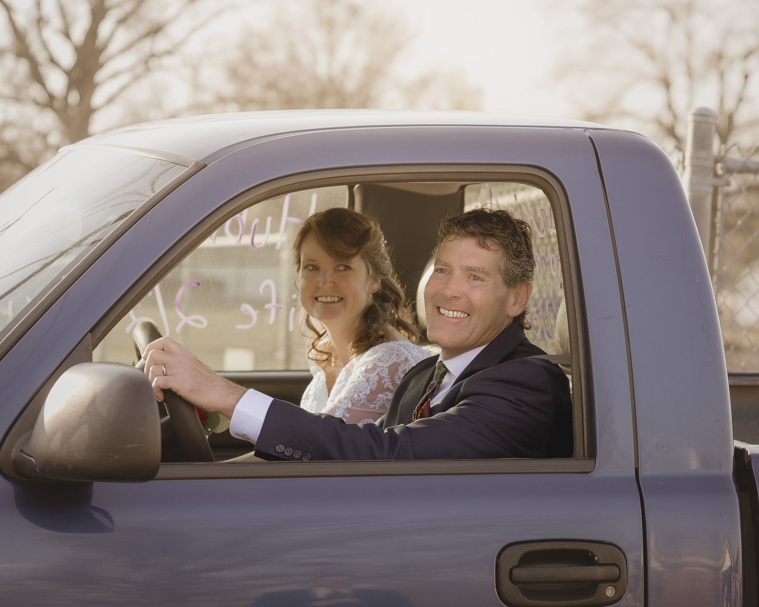 Sequence of people sitting in a pickup truck cab showing expressions of joy and laughter while driving.