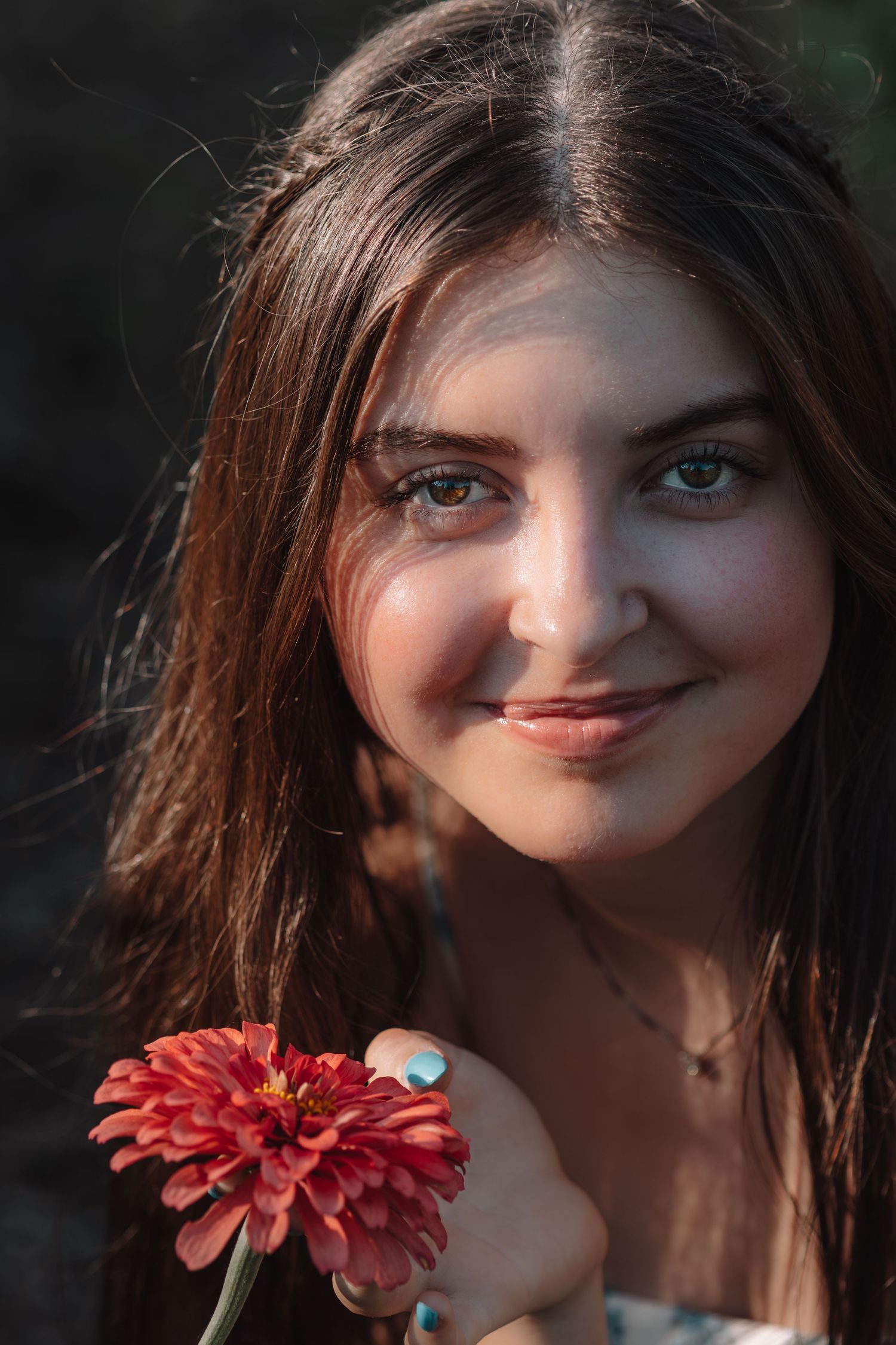 Portrait sequence showing progressive facial expressions and movements next to a red gerbera daisy flower.