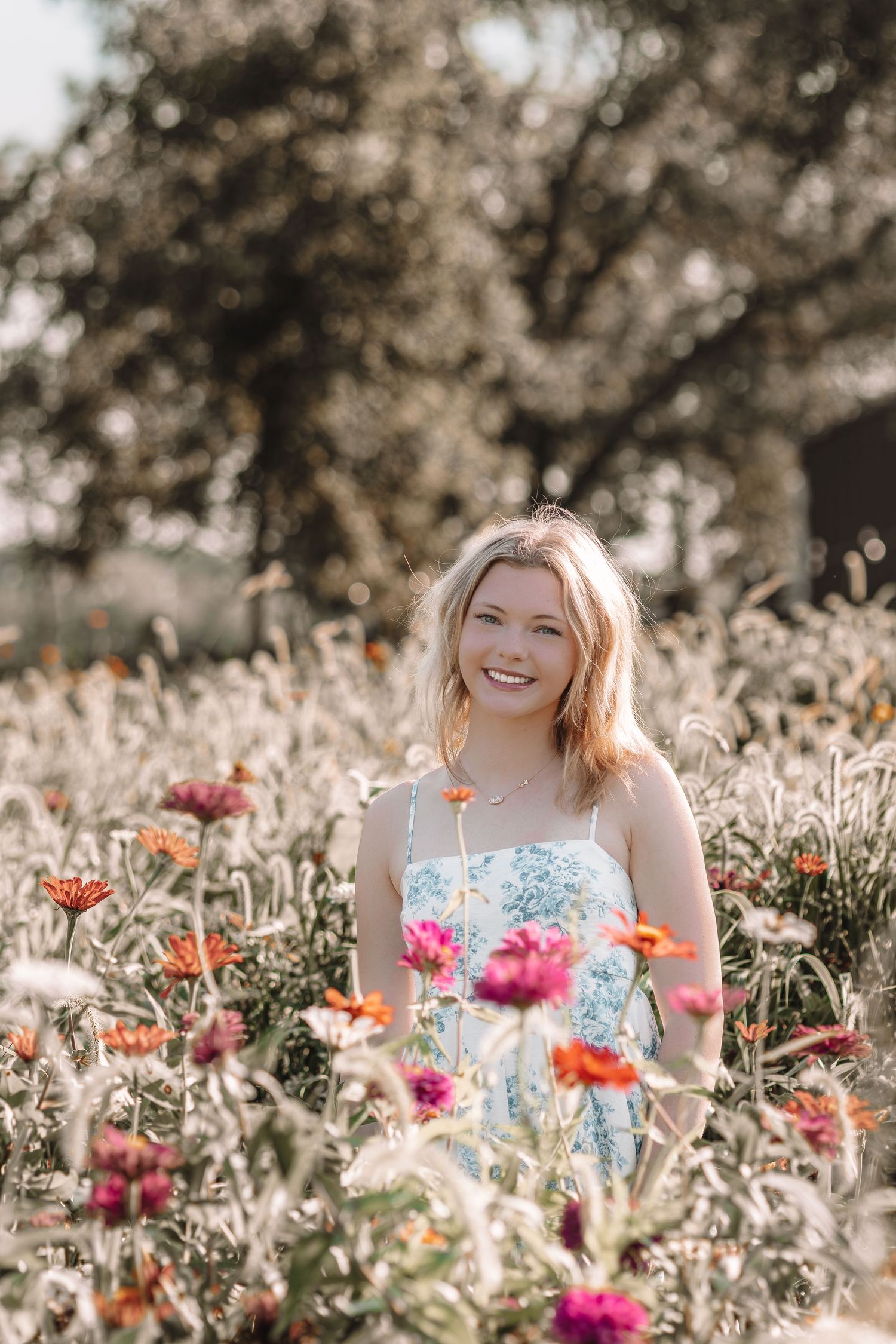 A dreamy portrait in a field of colorful wildflowers and poppies.