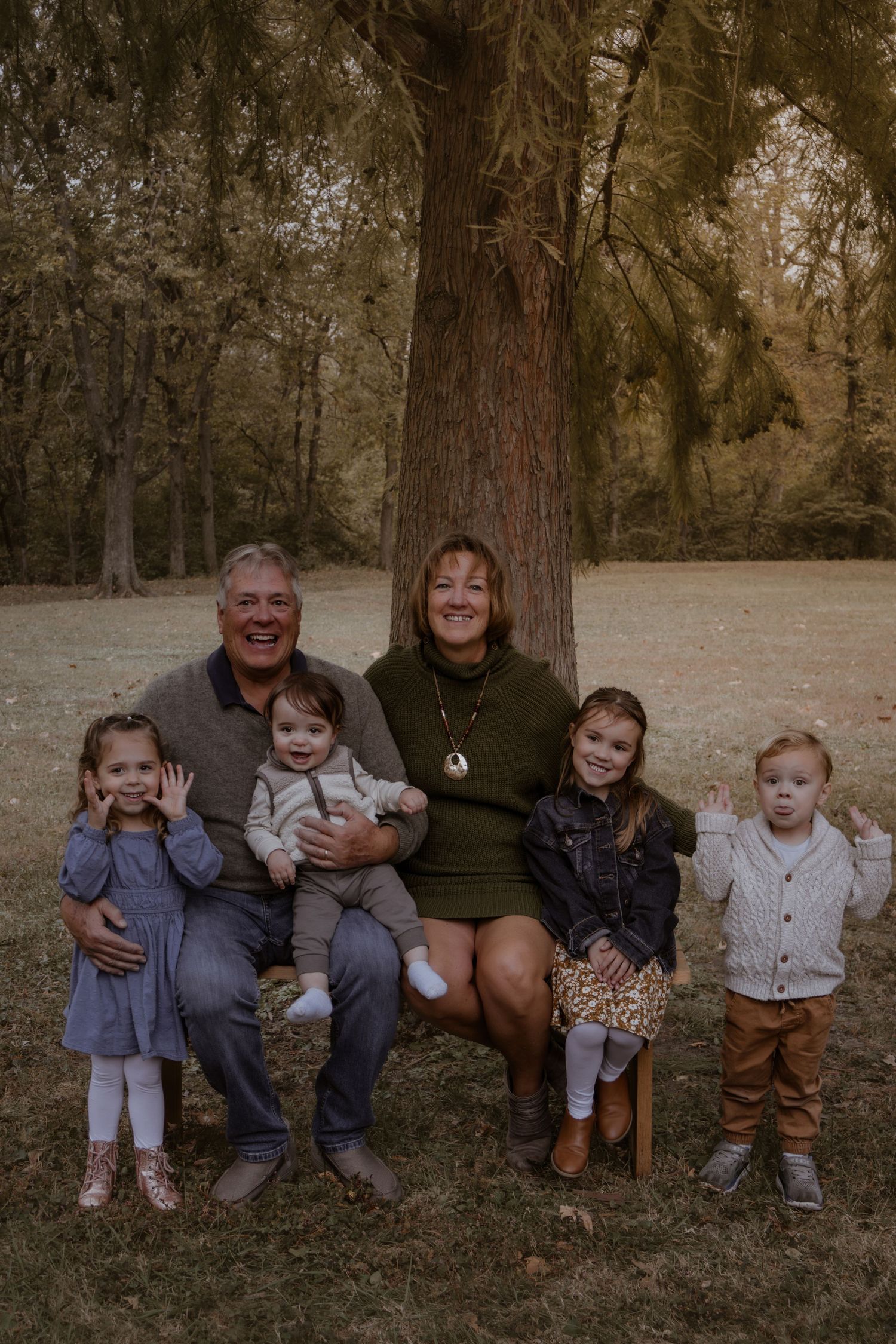 A series of outdoor family photos taken in a wooded setting with natural earth tones and rustic styling.