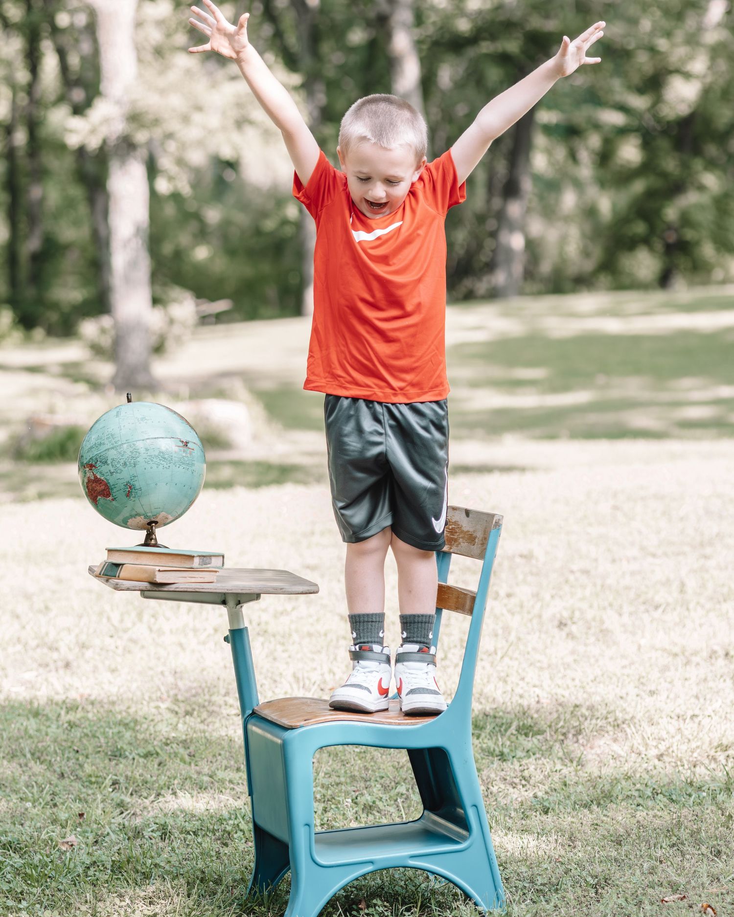 A series of joyful poses showing excitement for back to school with a student on a retro blue desk.