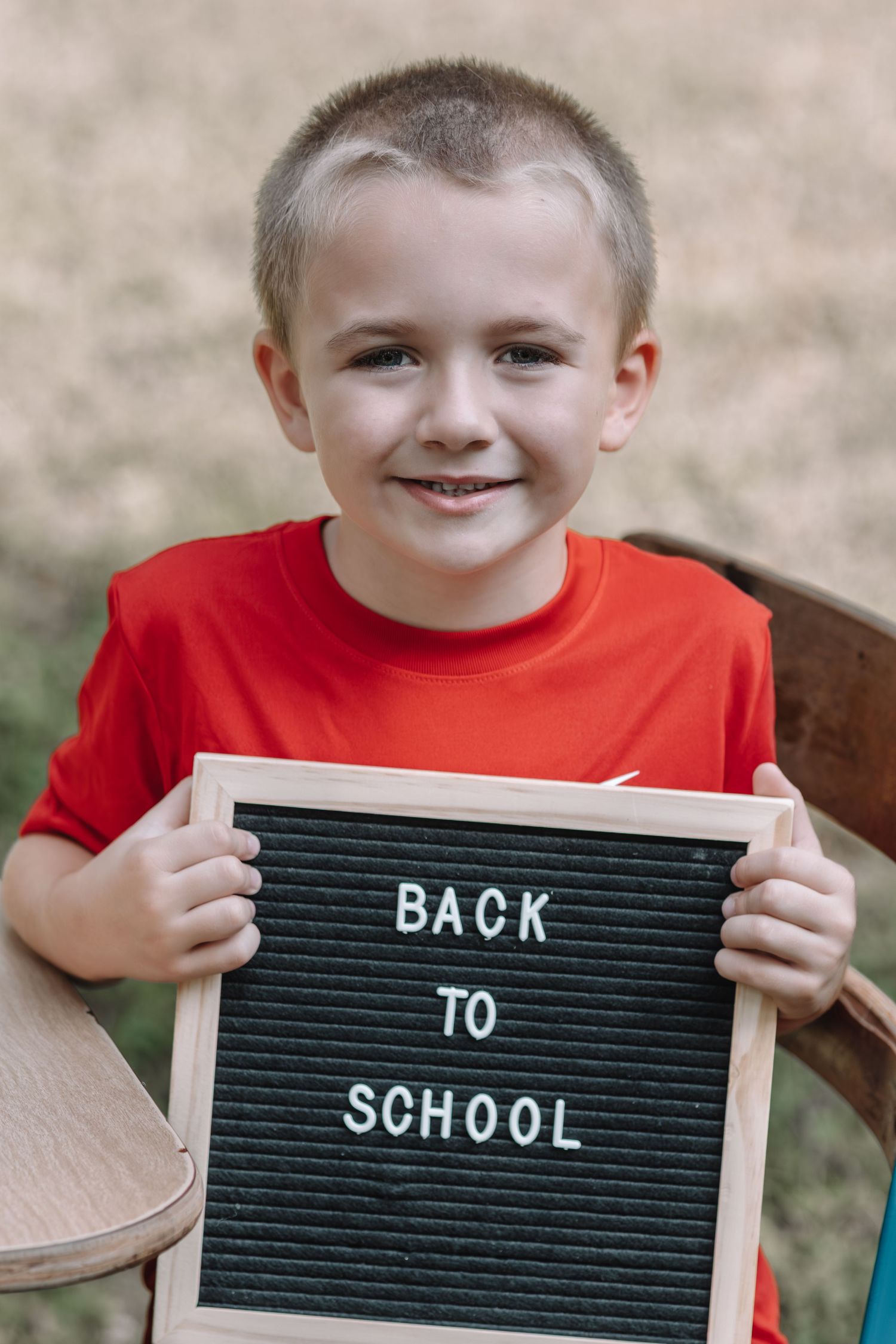 Progressive shots of a letterboard spelling out 'Back to School' with each word revealed one at a time.