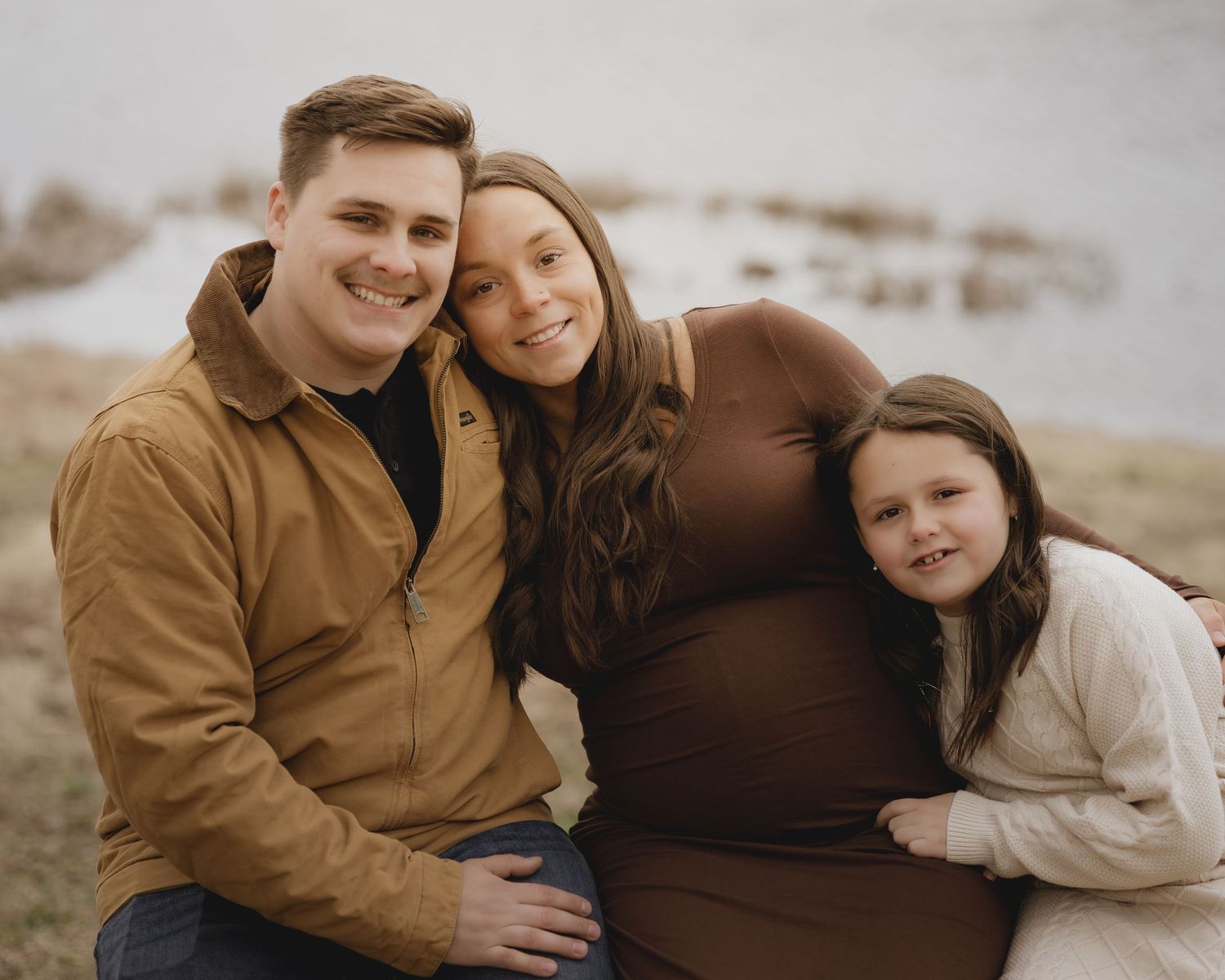 Intimate family portrait series captured in warm tones showing tender moments together.