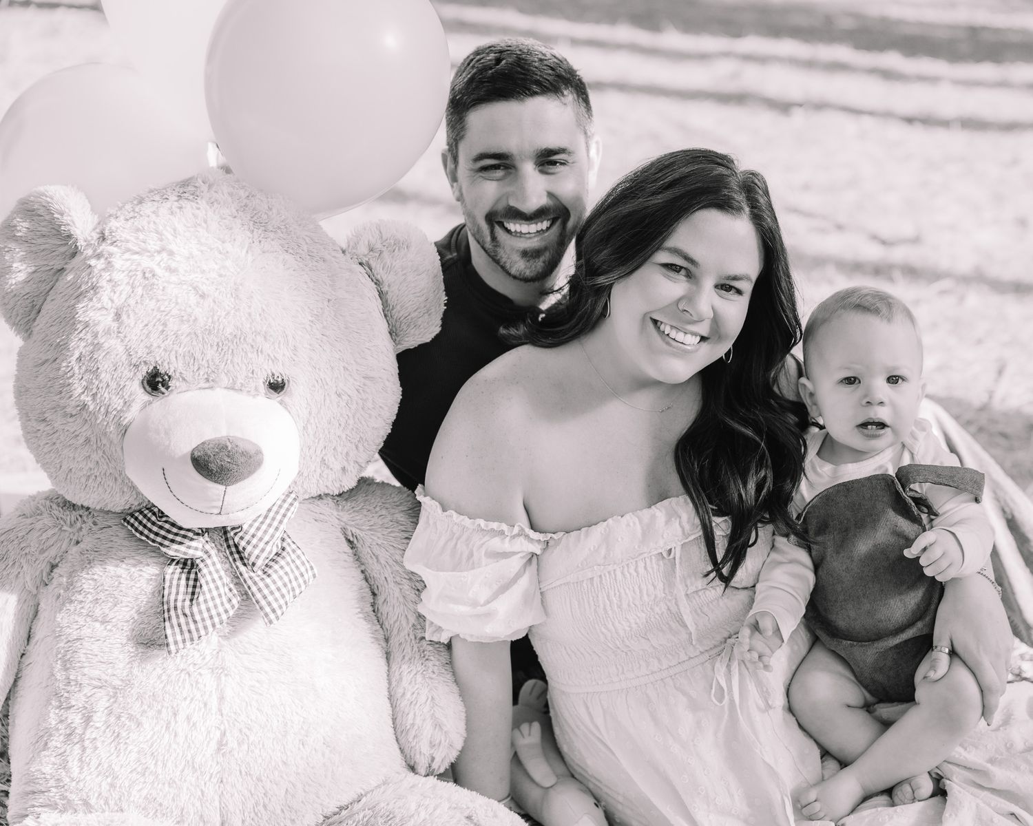 Black and white family portrait series showing joyful moments and laughter together.