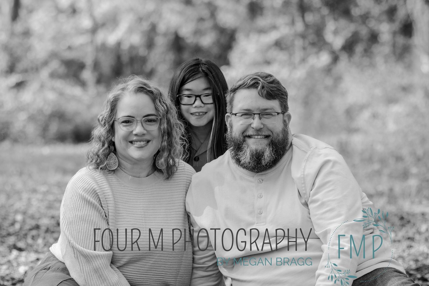 A series of black and white outdoor family photography portraits arranged in a horizontal collage.