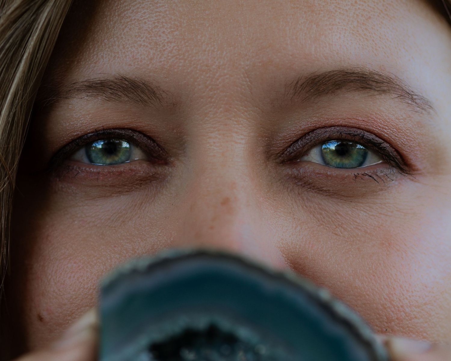 Close-up shots of eyes and facial features in a photography sequence.