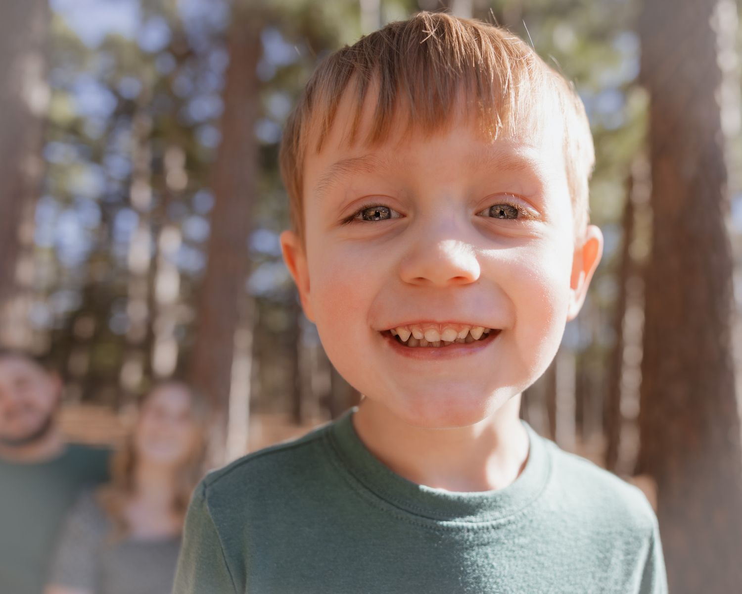 Close-up portraits showing joyful expressions during a family photo session.
