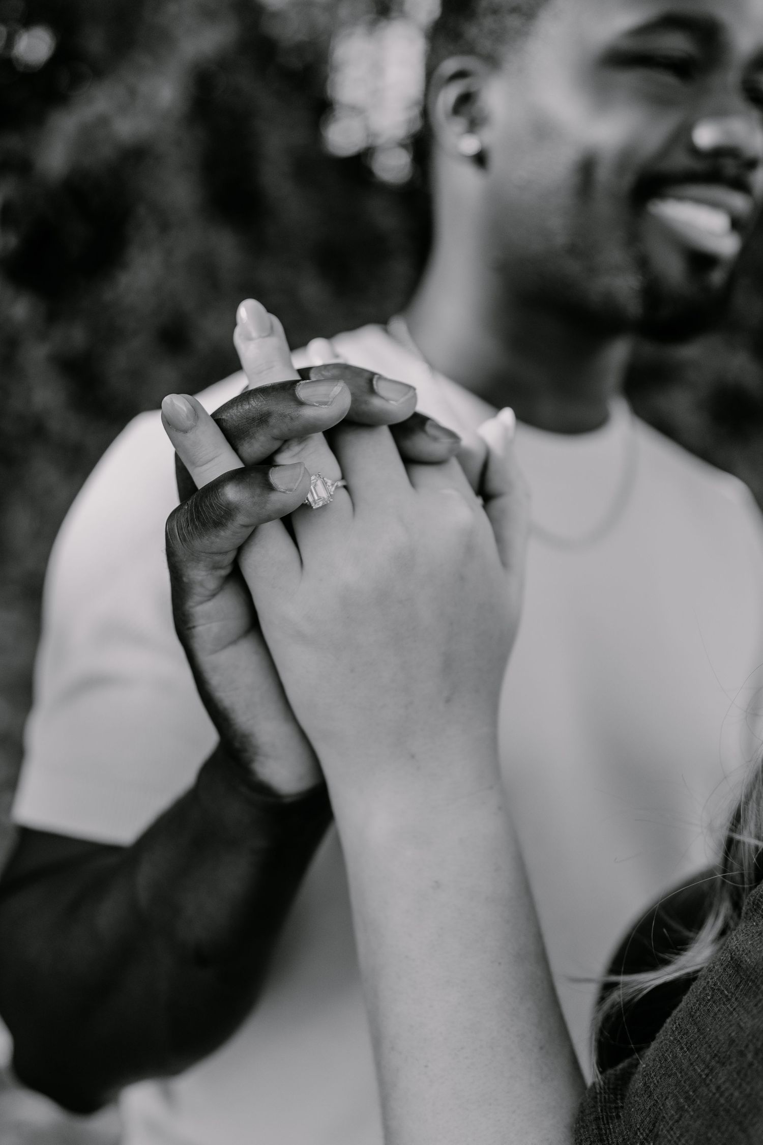 A series of black and white photos showing hands clasped together in an emotional moment.