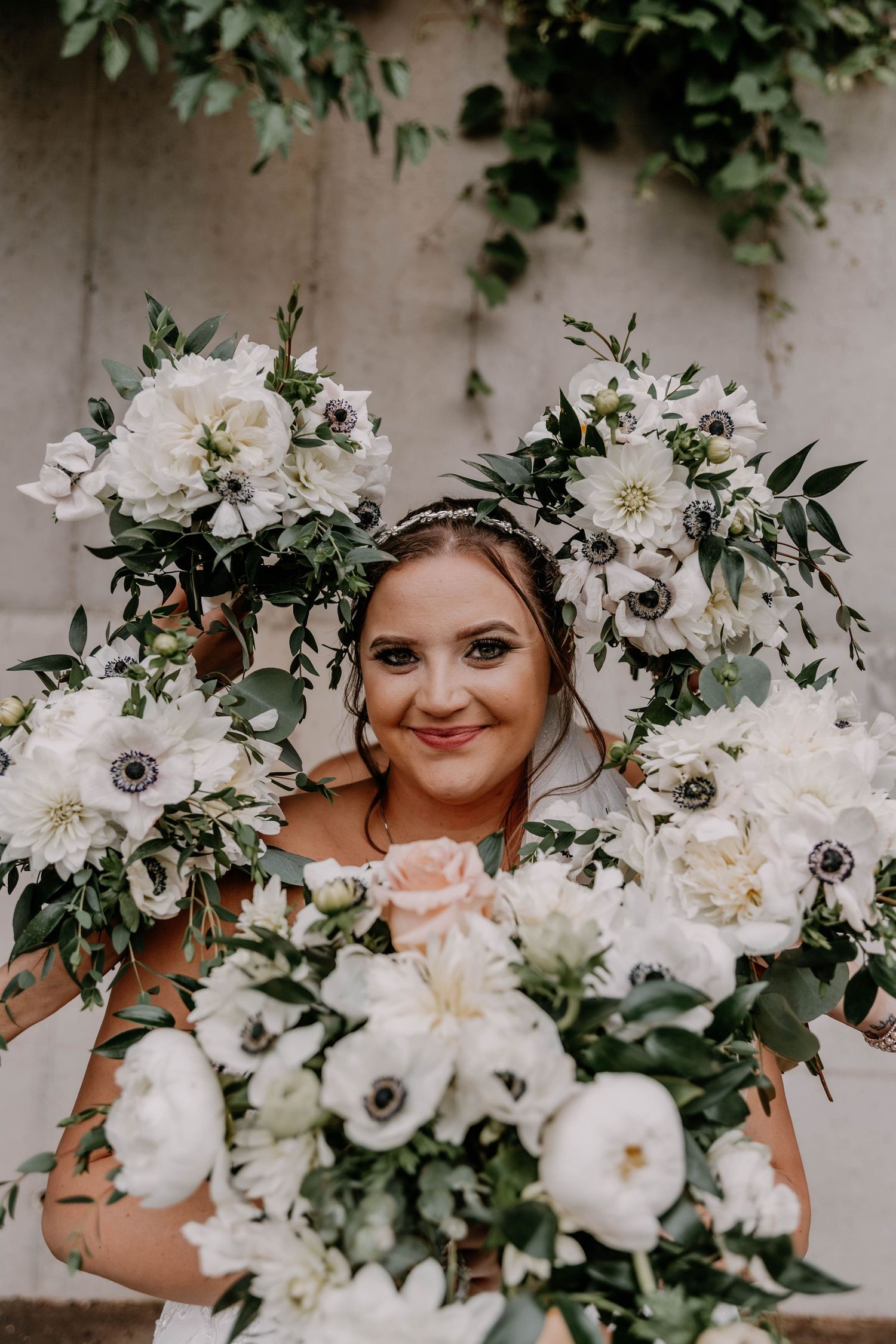 Beautiful white and blush floral arrangement with anemones and garden roses.