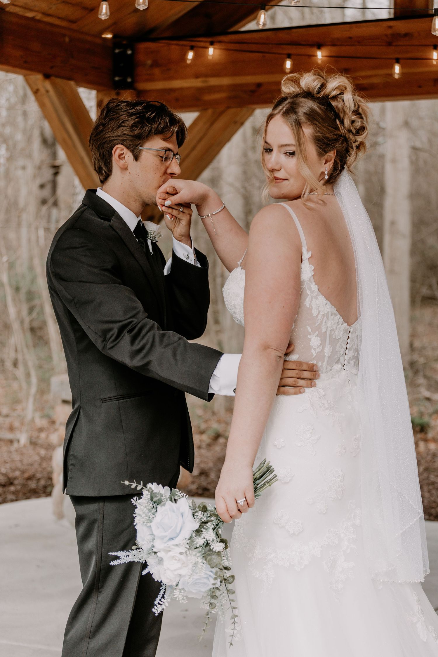 A romantic moment between newlyweds as they embrace during their wedding photoshoot.