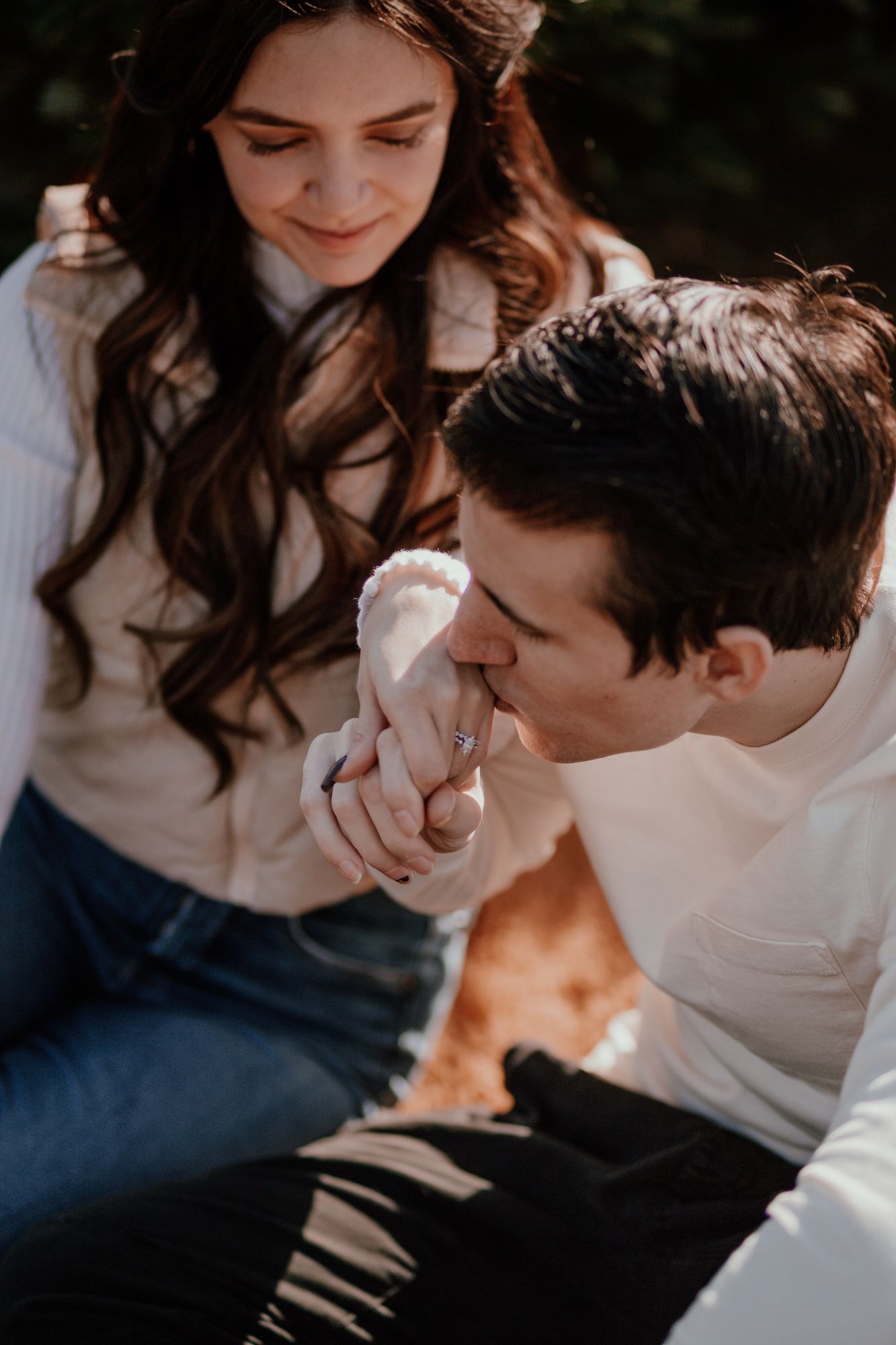 Intimate close-up of couple sharing tender moment during outdoor photo session.