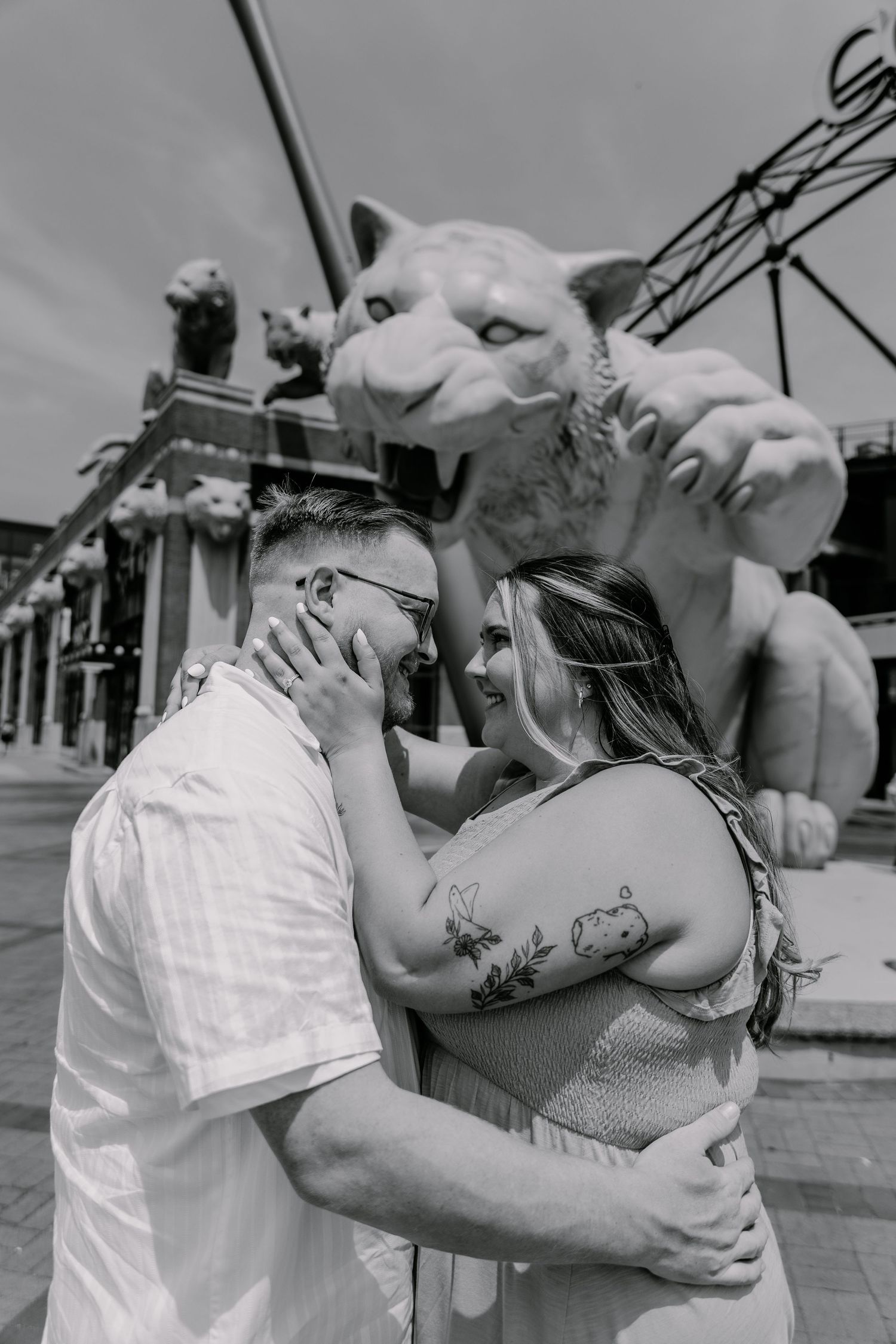 A series of intimate black and white photographs showing a couple dancing and embracing in a romantic moment.