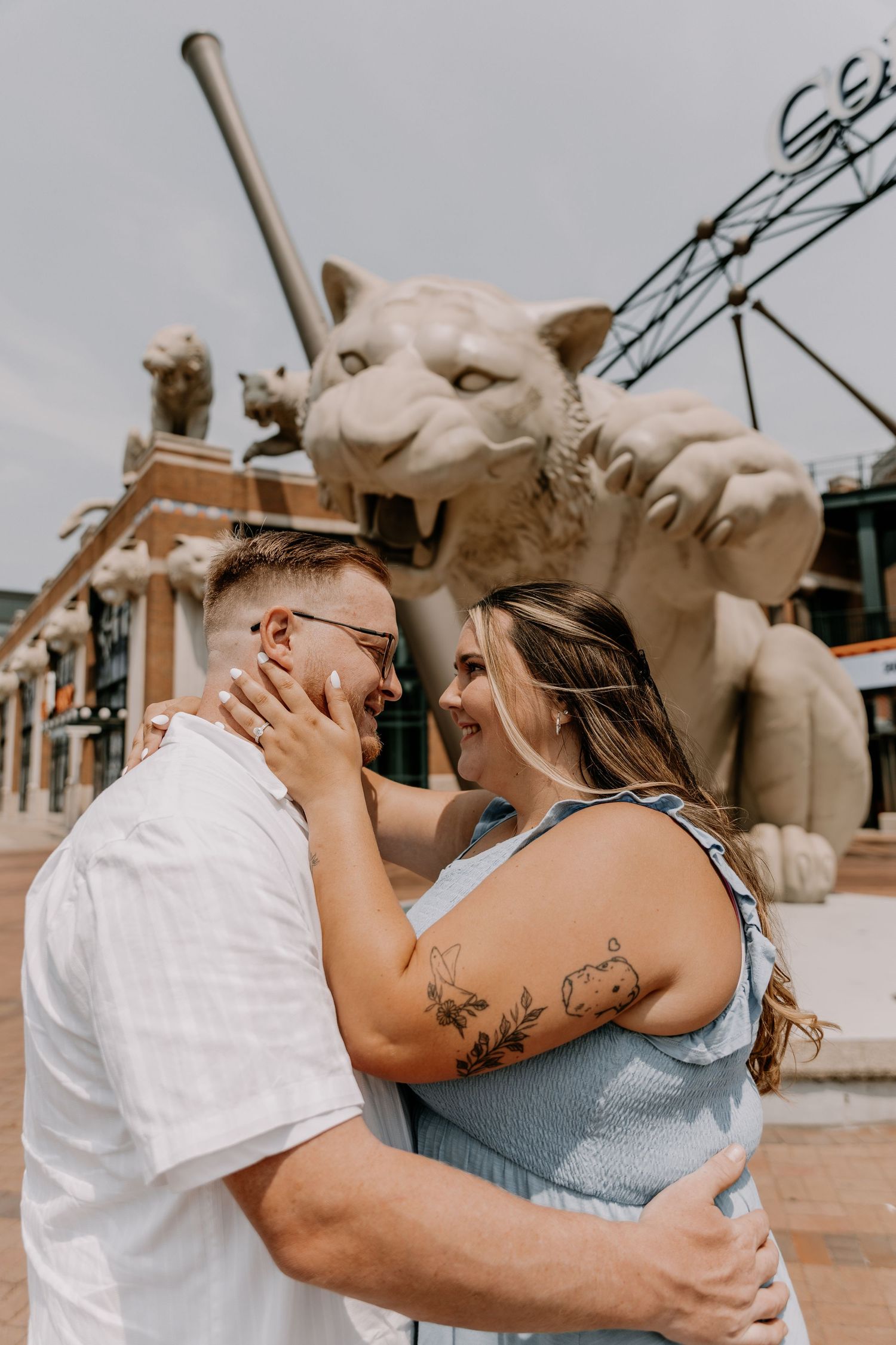 A couple embraces and laughs joyfully in a series of candid engagement photos showing their playful connection.