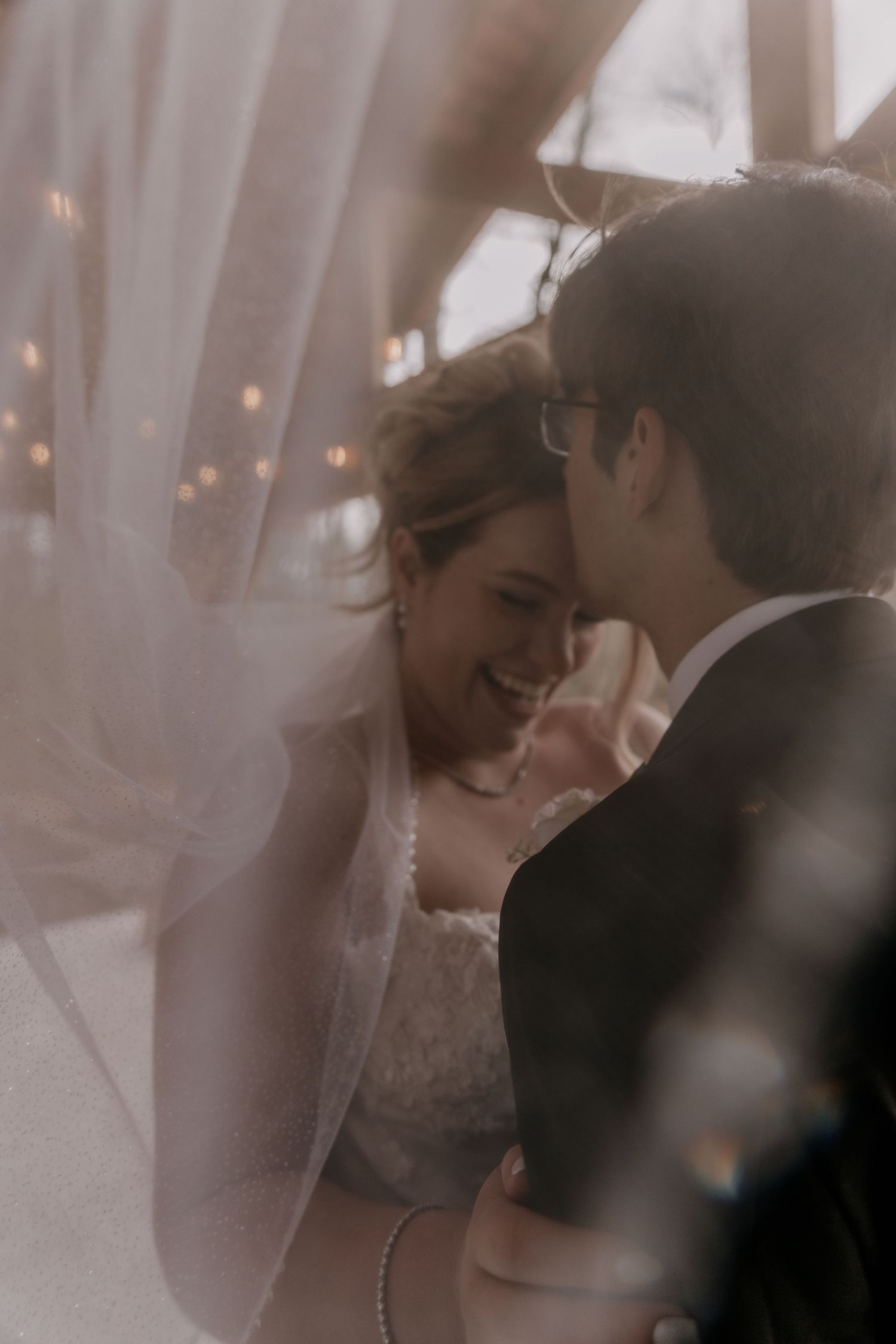 Romantic close-up of couple sharing tender moment during wedding ceremony.