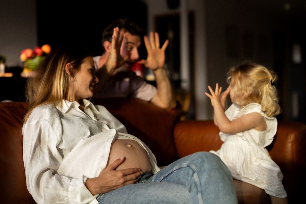 Series of tender family moments captured in warm indoor lighting.