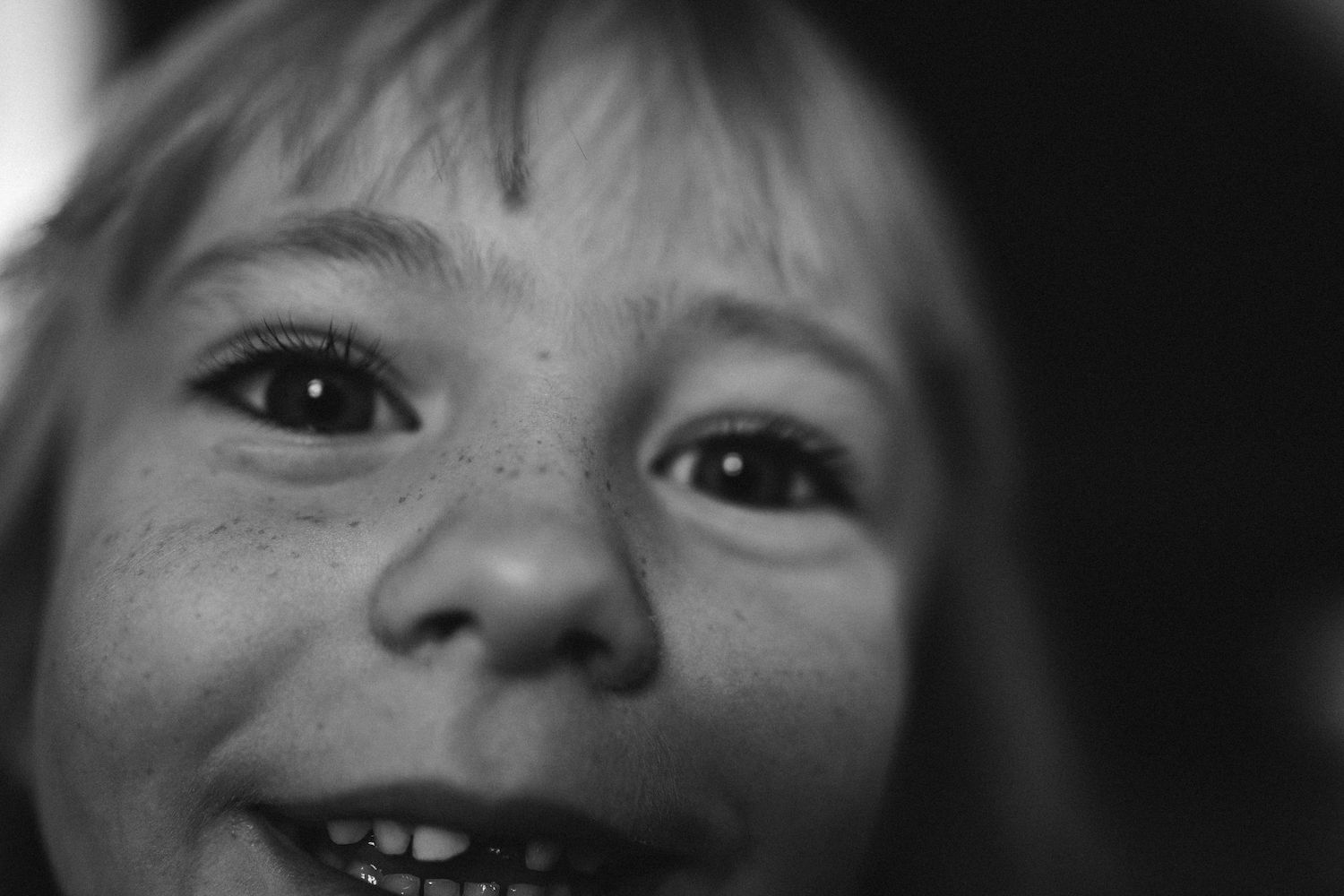 Close-up black and white portrait sequence showing expressive eyes and emotions.