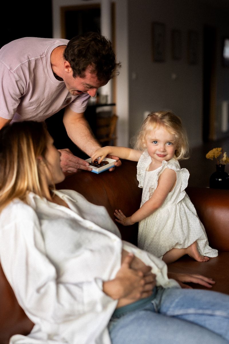 Indoor scene with white clothing and gentle movement captured in natural light.