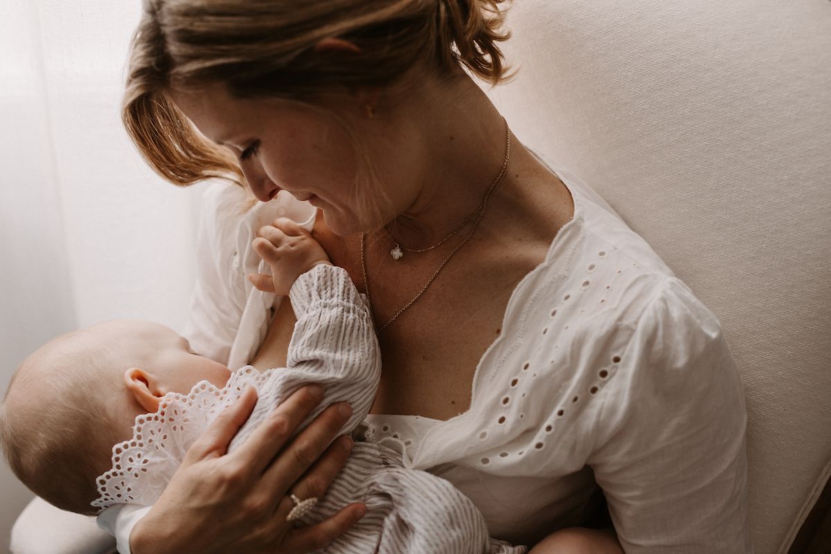 Tender moment of nurturing and bonding in soft natural light.