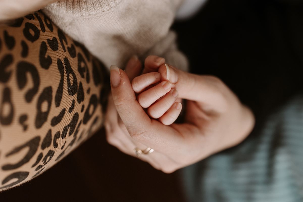 Close-up view of hands with delicate details and patterns.
