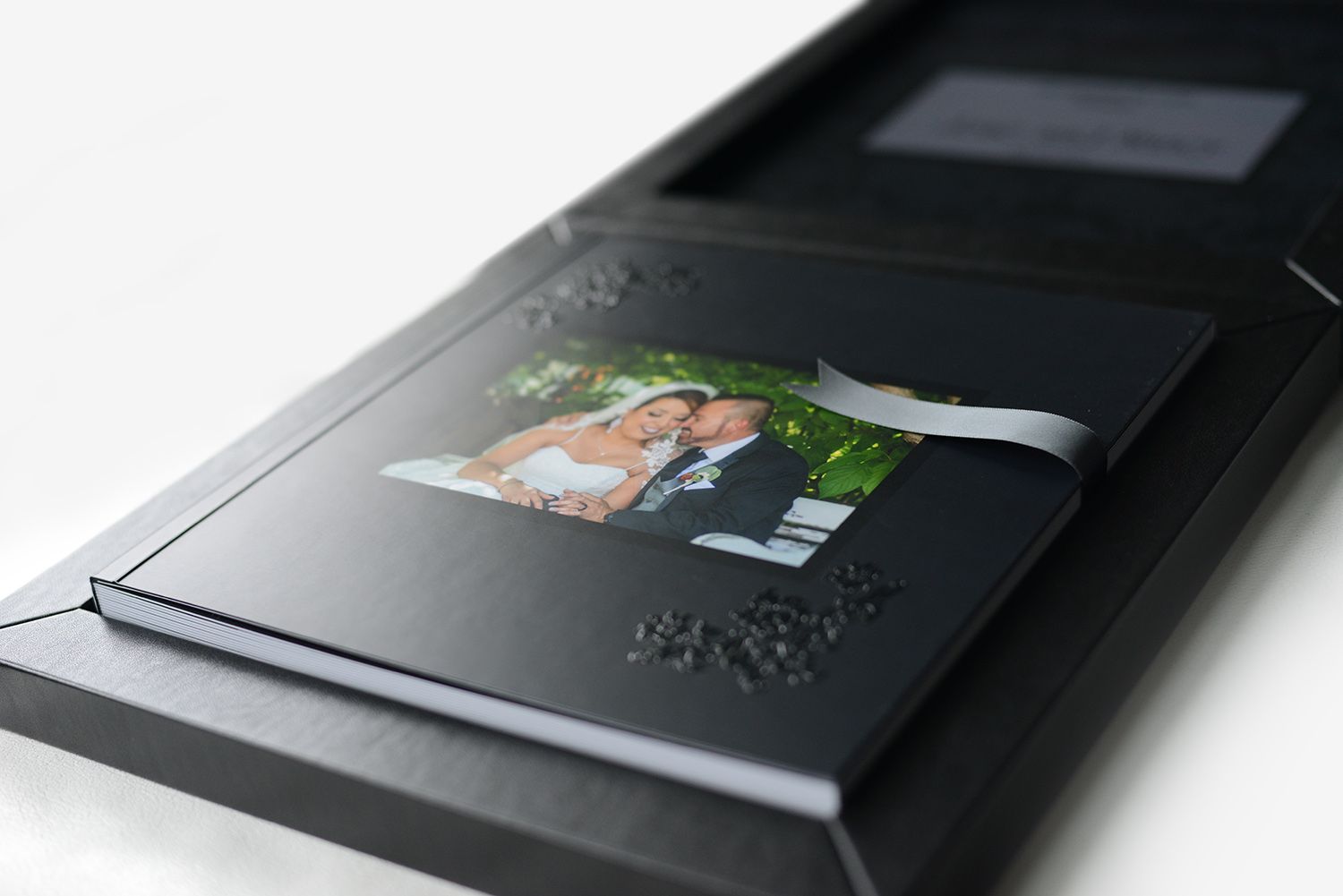 luxury wedding book in a black custom box with embossed design by luba wold lt concepts