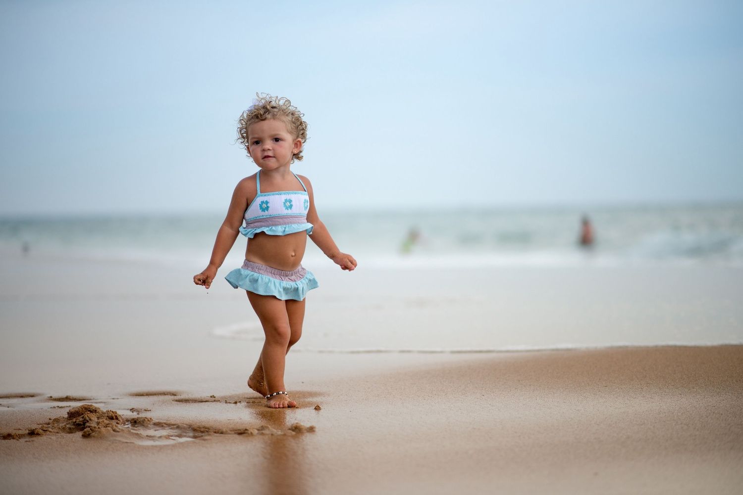 Toddler on the beach is a precious thing