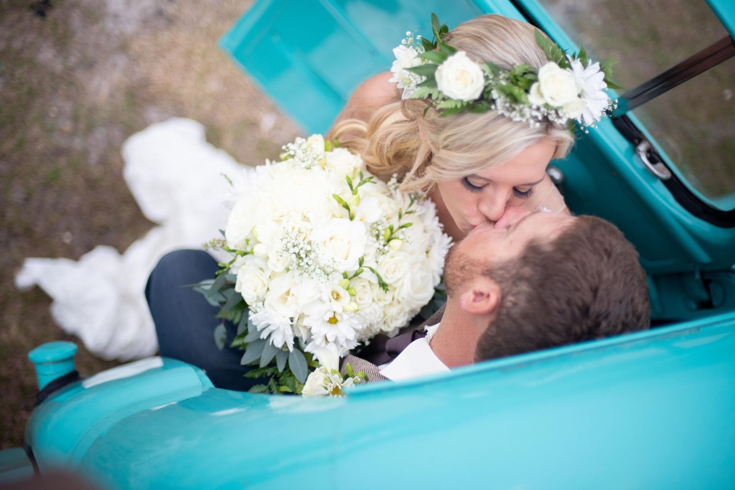 Bride and groom sharing a first kiss