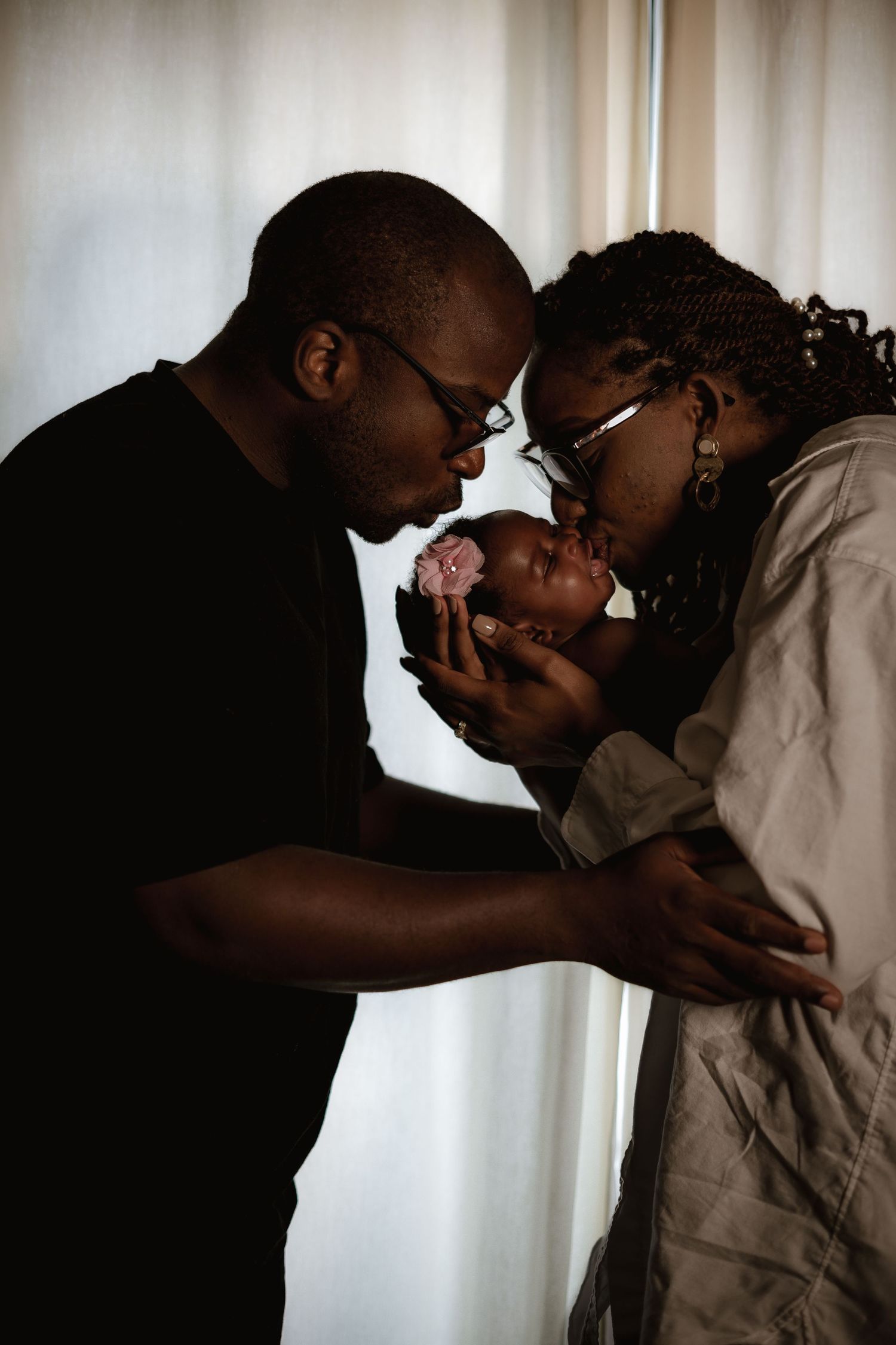 Intimate family moment sharing love with newborn baby.