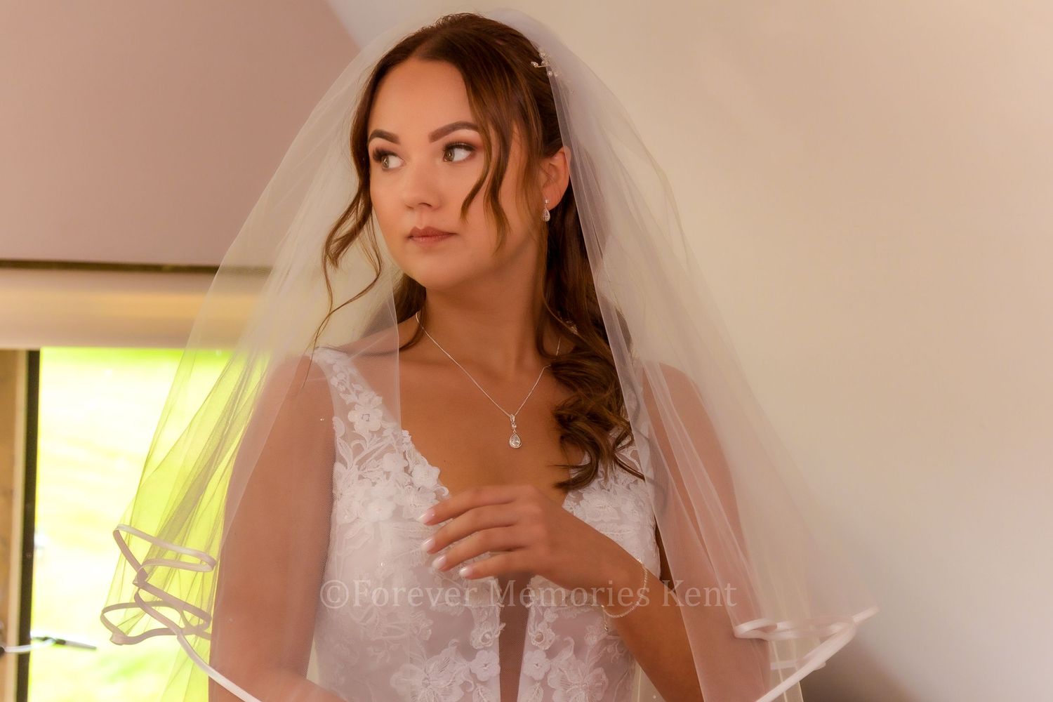 Bridal portrait capturing a serene moment before the ceremony.