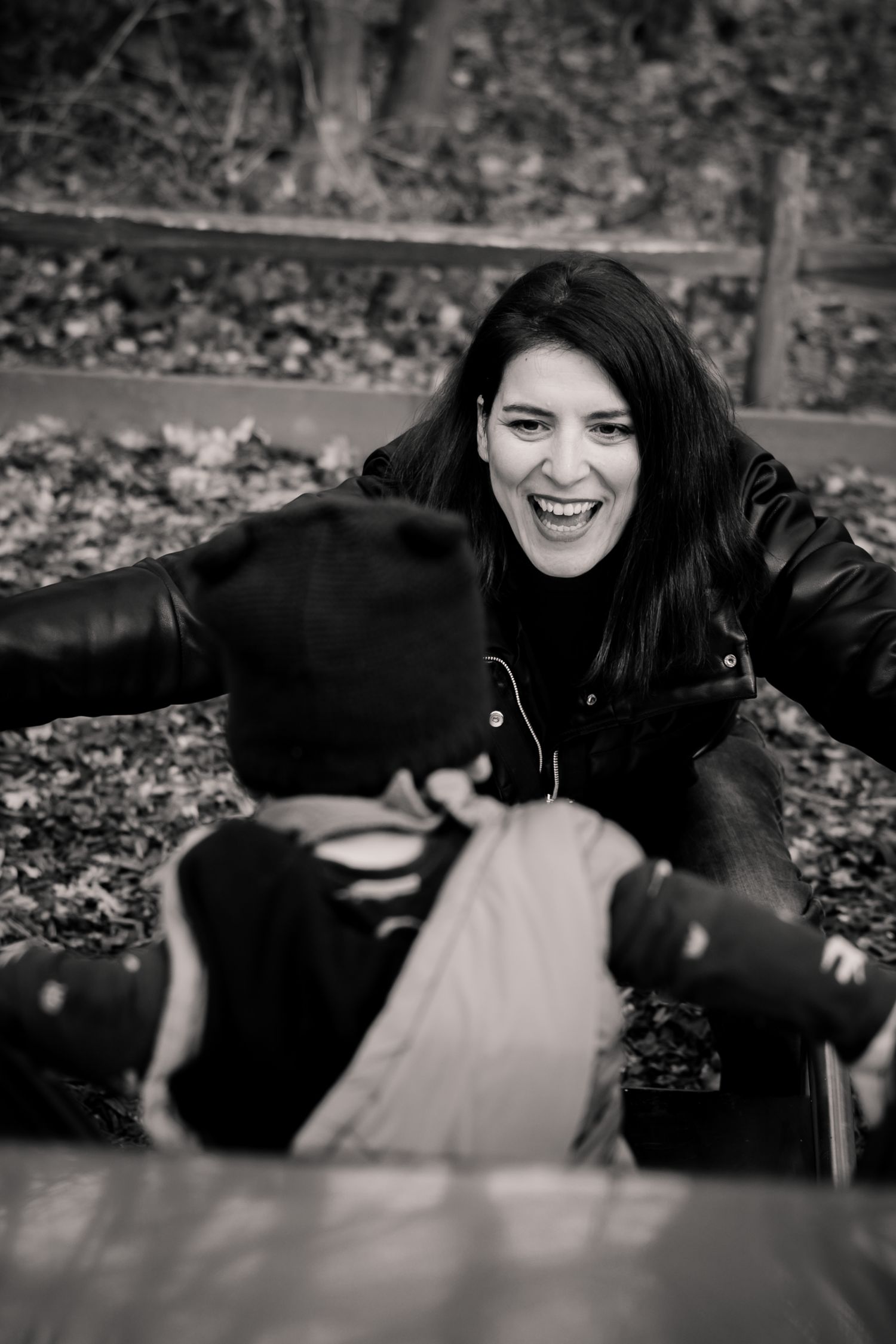 Black and white series of expressive portraits showing genuine laughter and joy.