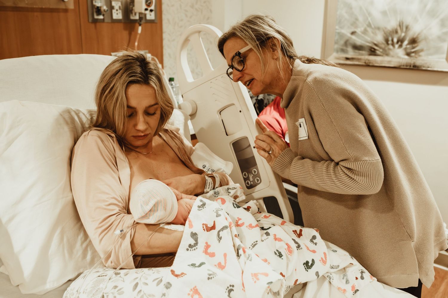 A couple sharing romantic moments in bed while drinking coffee and reading together in cozy beige sweaters.